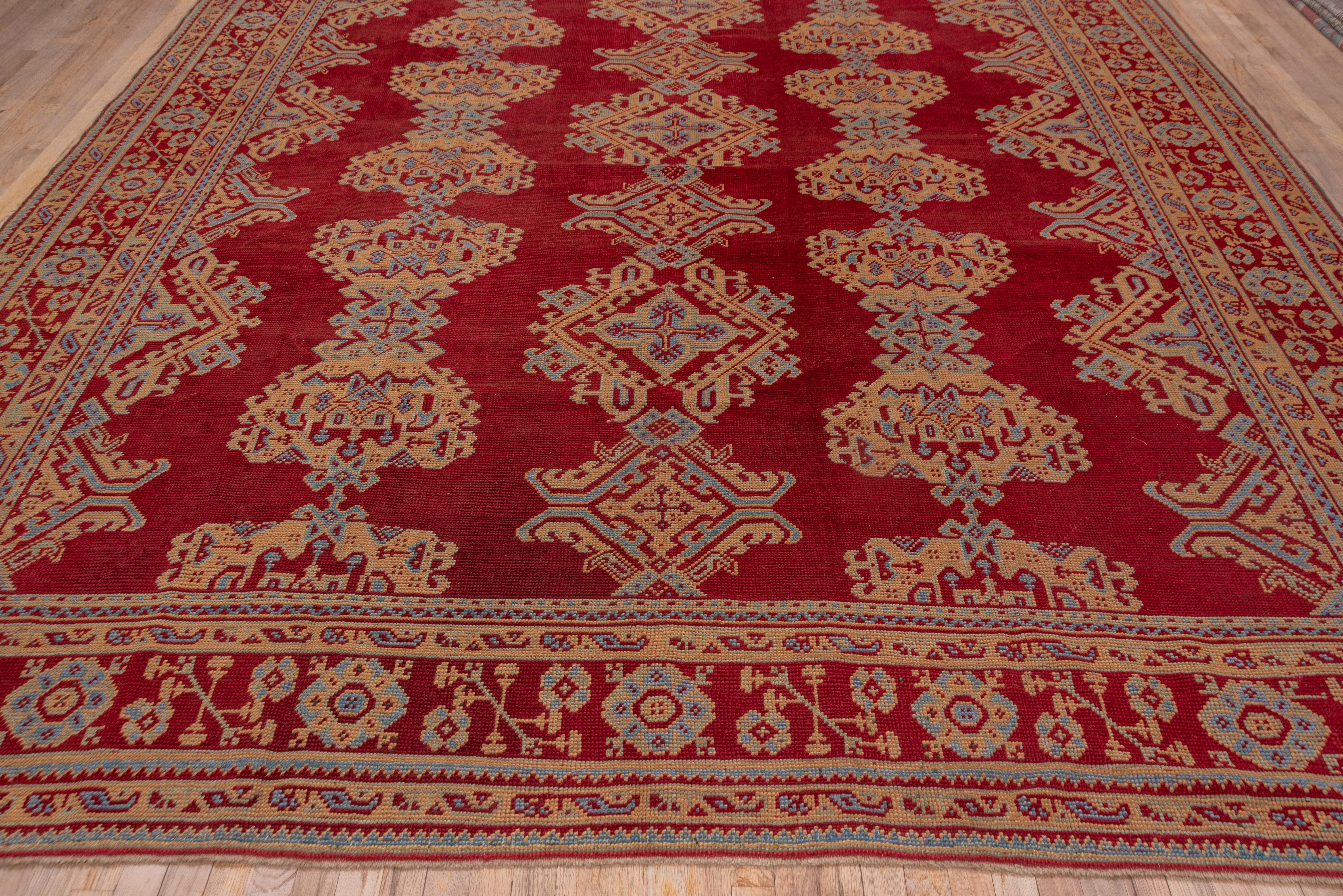 Turkish Antique Red Oushak Rug with Orange & Blue Borders, Circa 1920s For Sale