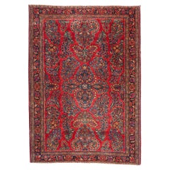 Tapis Sarouk rouge persan à fleurs anciennes