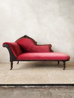Antique Red Velvet Chaise Longue with Carved Wooden Frame from Around 1900
