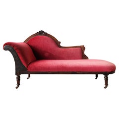 Antique Red Velvet Chaise Longue with Carved Wooden Frame from Around 1900