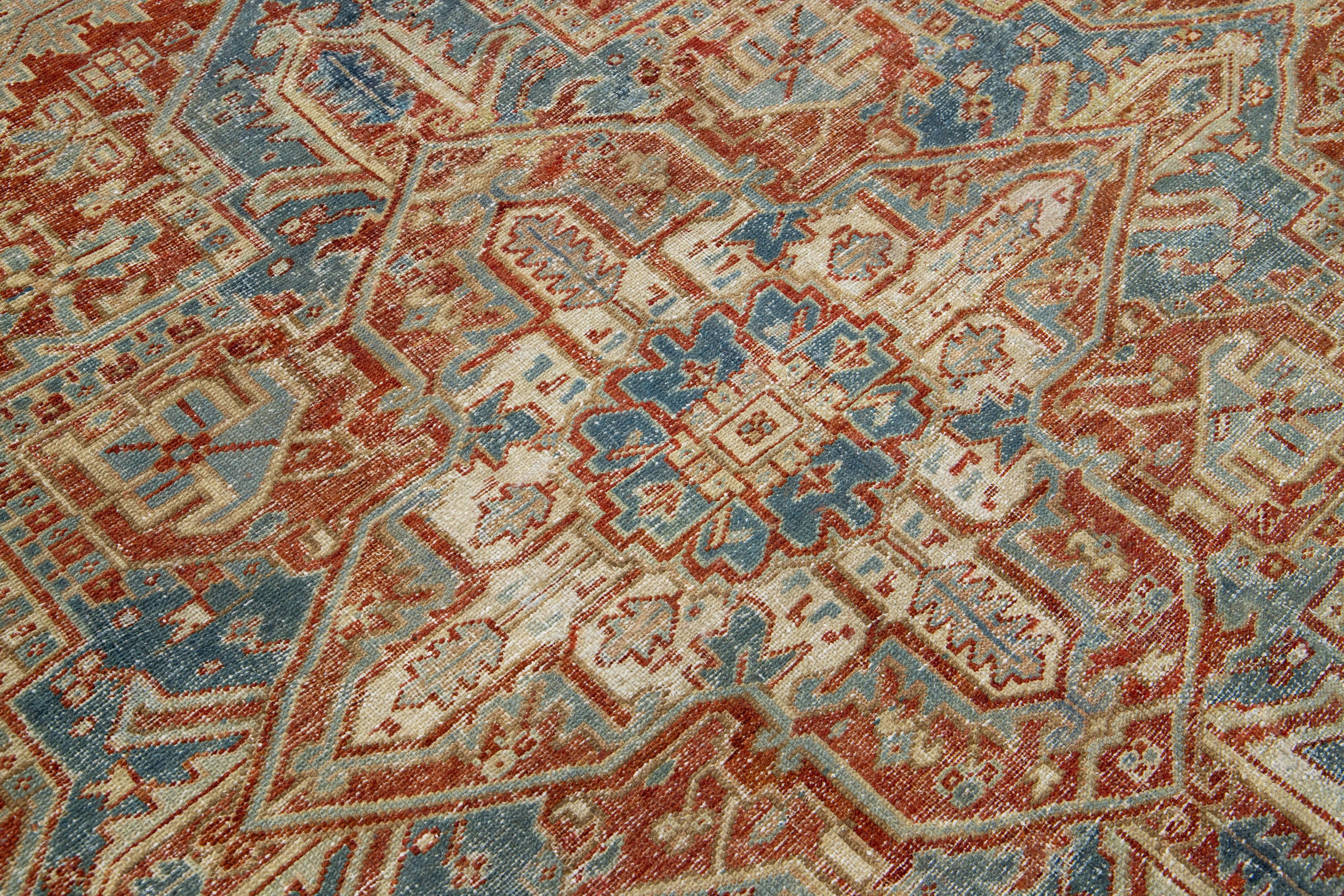 Hand-Knotted Antique Red Wool Rug Persian Heriz Featuring a Medallion Motif  For Sale