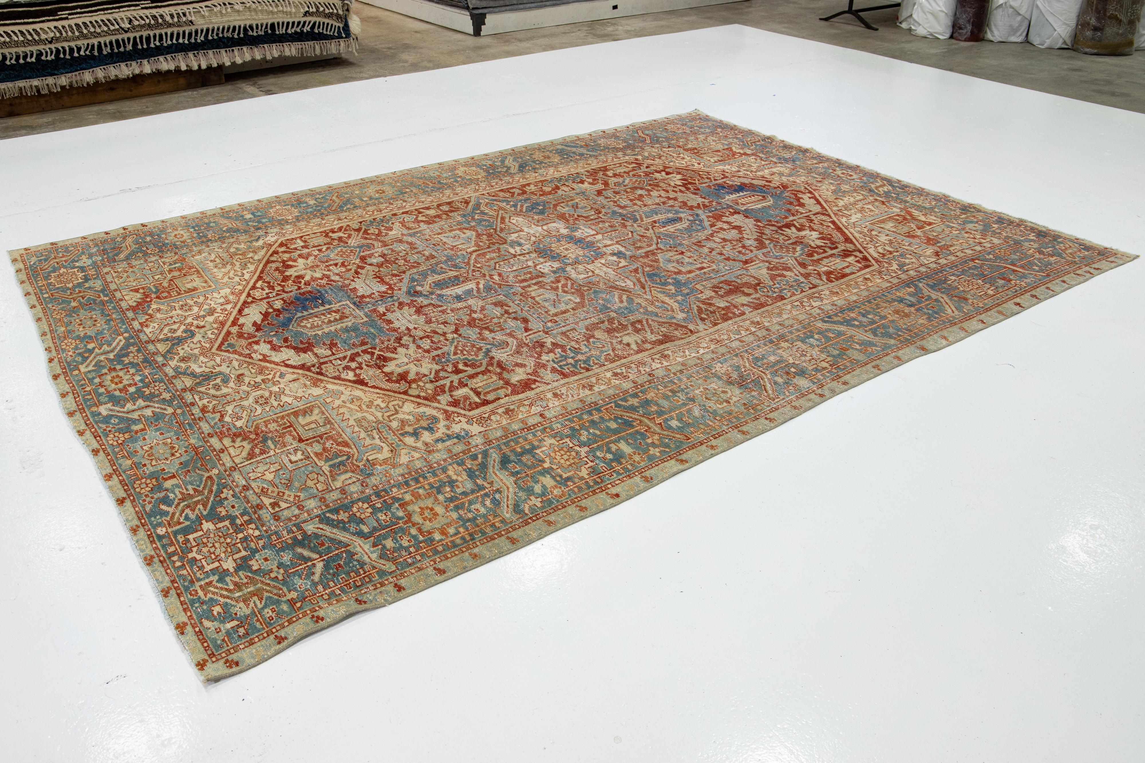 Antique Red Wool Rug Persian Heriz Featuring a Medallion Motif  In Excellent Condition For Sale In Norwalk, CT