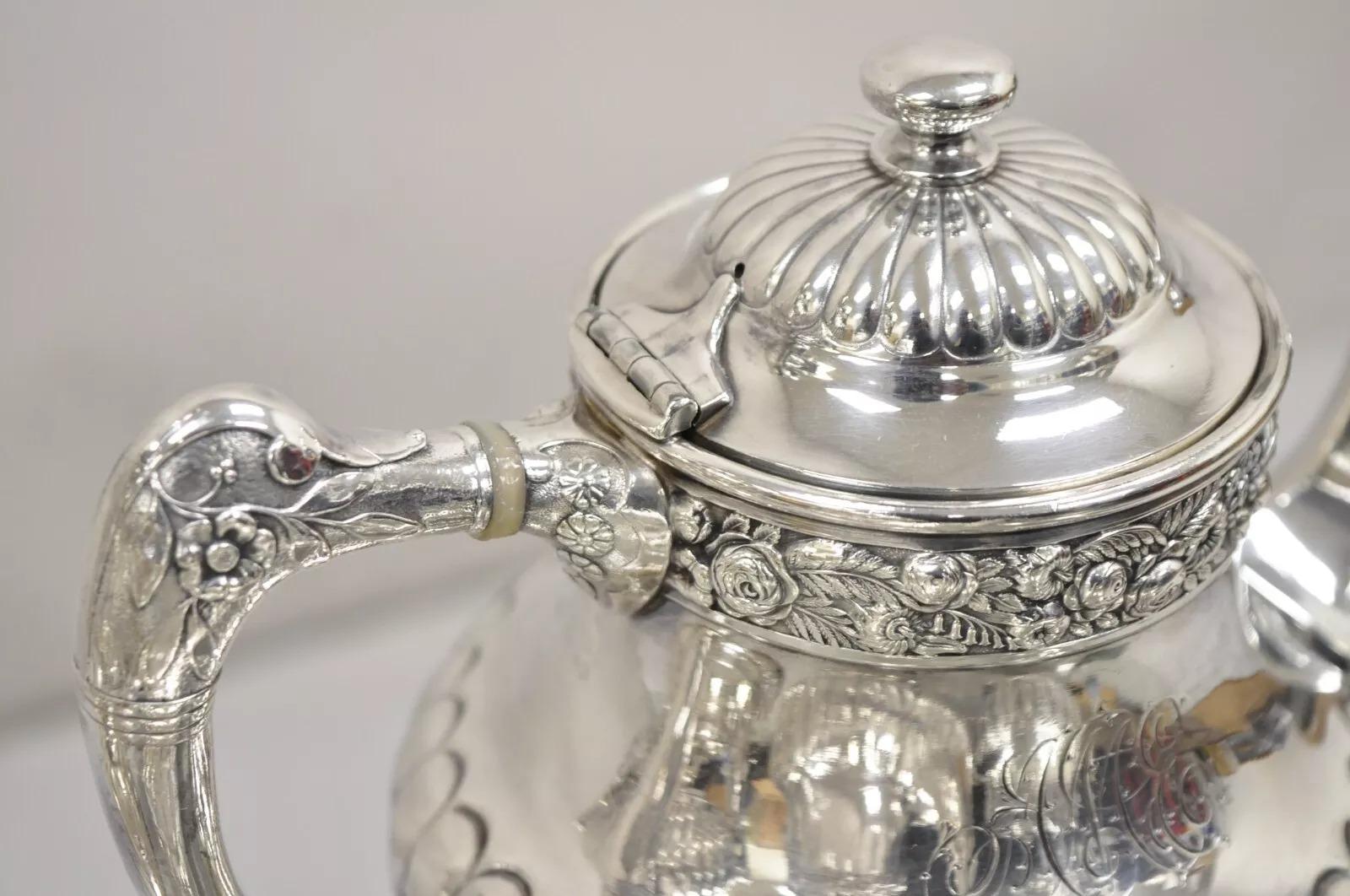Antique Reed & Barton 3221 Victorian Silver Plated Floral Repousse 6 Pc Tea Set. Listing includes (1) Tilting tea pot on base, (1) Lidded sugar bowl, (1) Open sugar bowl, (1) Creamer with handle, (2) Coffee Pots all with engraved monogram. Circa
