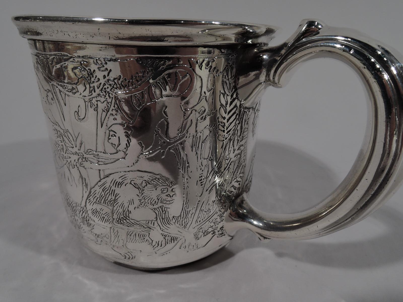 Art Deco sterling silver 3-piece baby set. Made by Reed & Barton in Taunton, Mass., circa 1920, This set comprises mug, cereal bowl, and plate. Acid-etched safari with leaping gazelles, striding giraffes, wading hippos, and plodding elephants. A