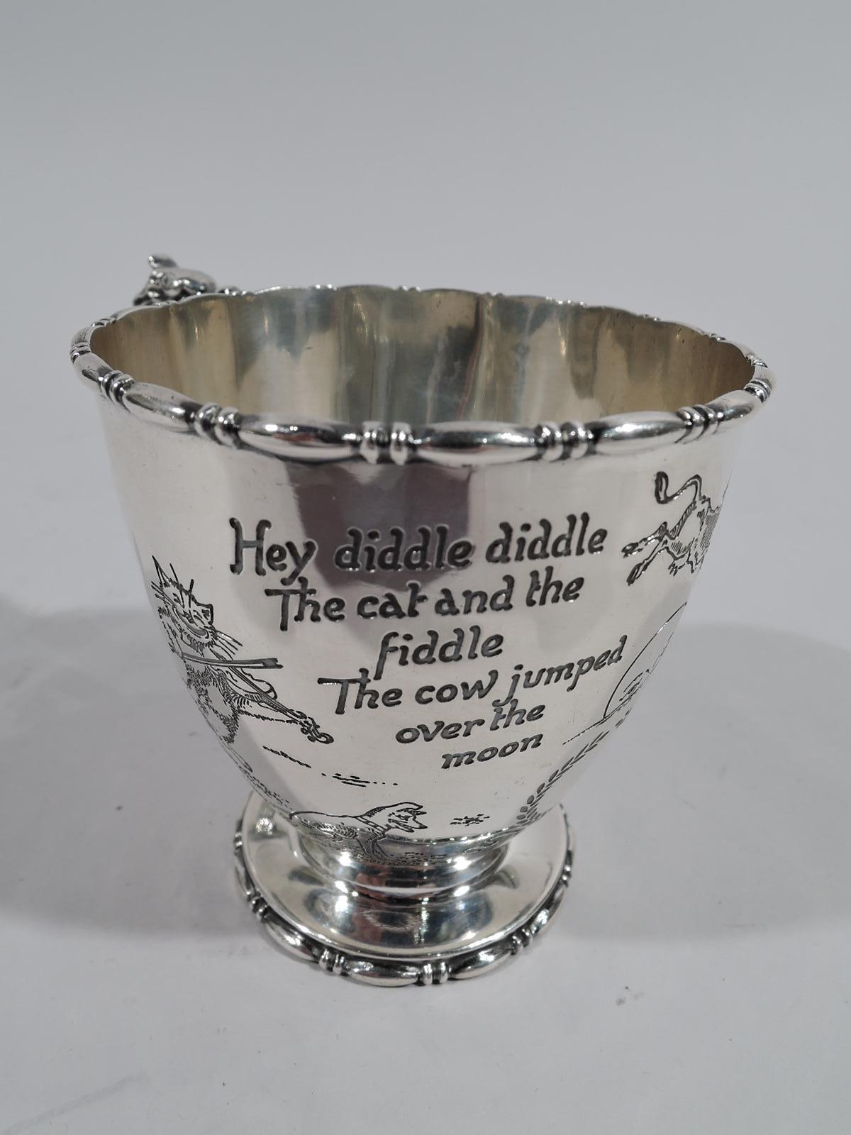 Edwardian sterling silver baby cup with nursery rhyme motif. Made by Reed & Barton in Taunton, Mass., circa 1910. Curved cone on circular foot. Scroll handle with leaf-wrapped animal head. Applied bead-and-reel rims. Engraved text and imagery for