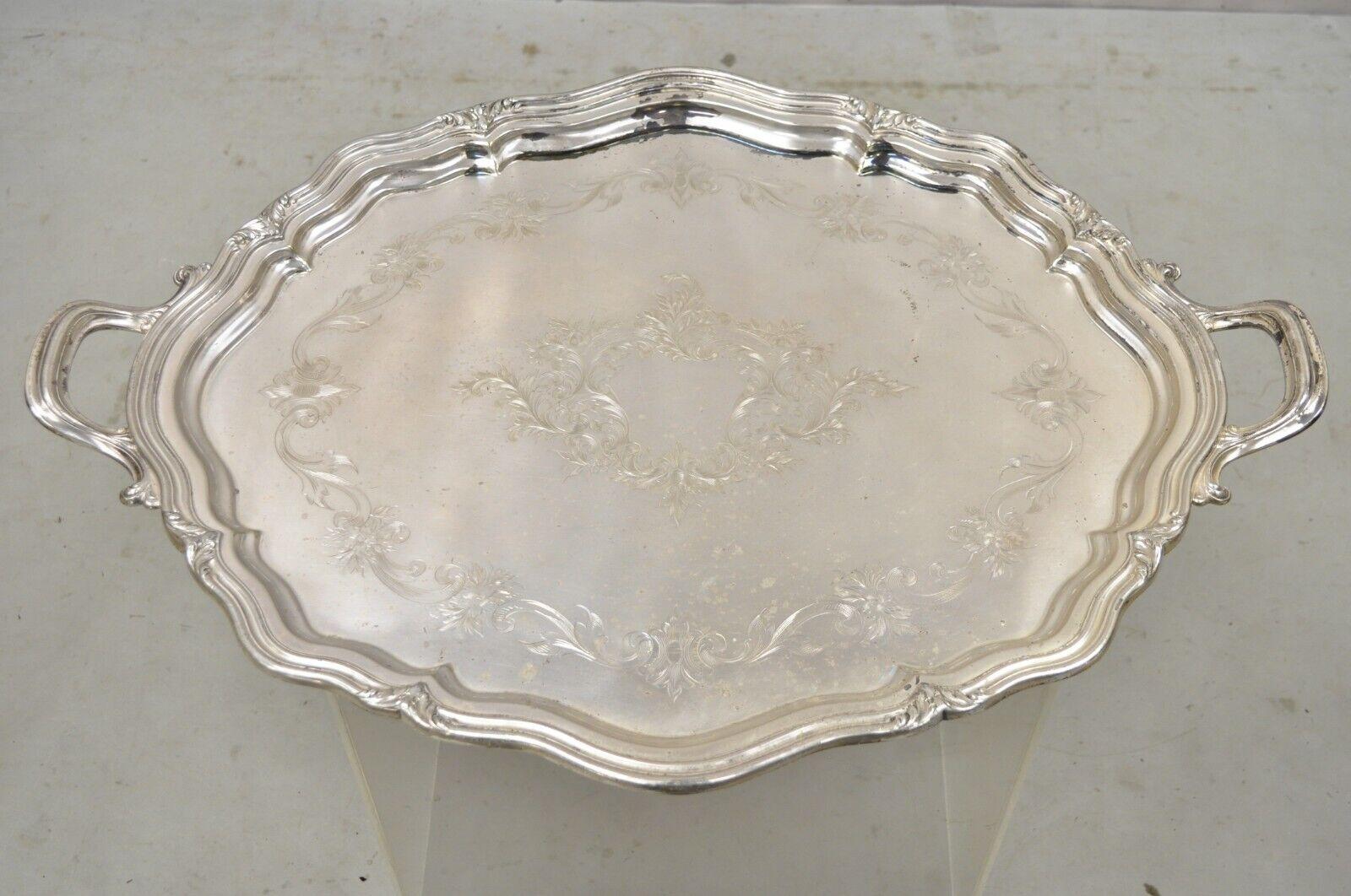 Antique Reed & Barton EPNS 06143 Silver Plated Handle Tray Serving Platter. Item features an ornate etched center, ornate twin handles, very nice vintage item, great style and form. circa Early 20th century. Measurements: 1.75