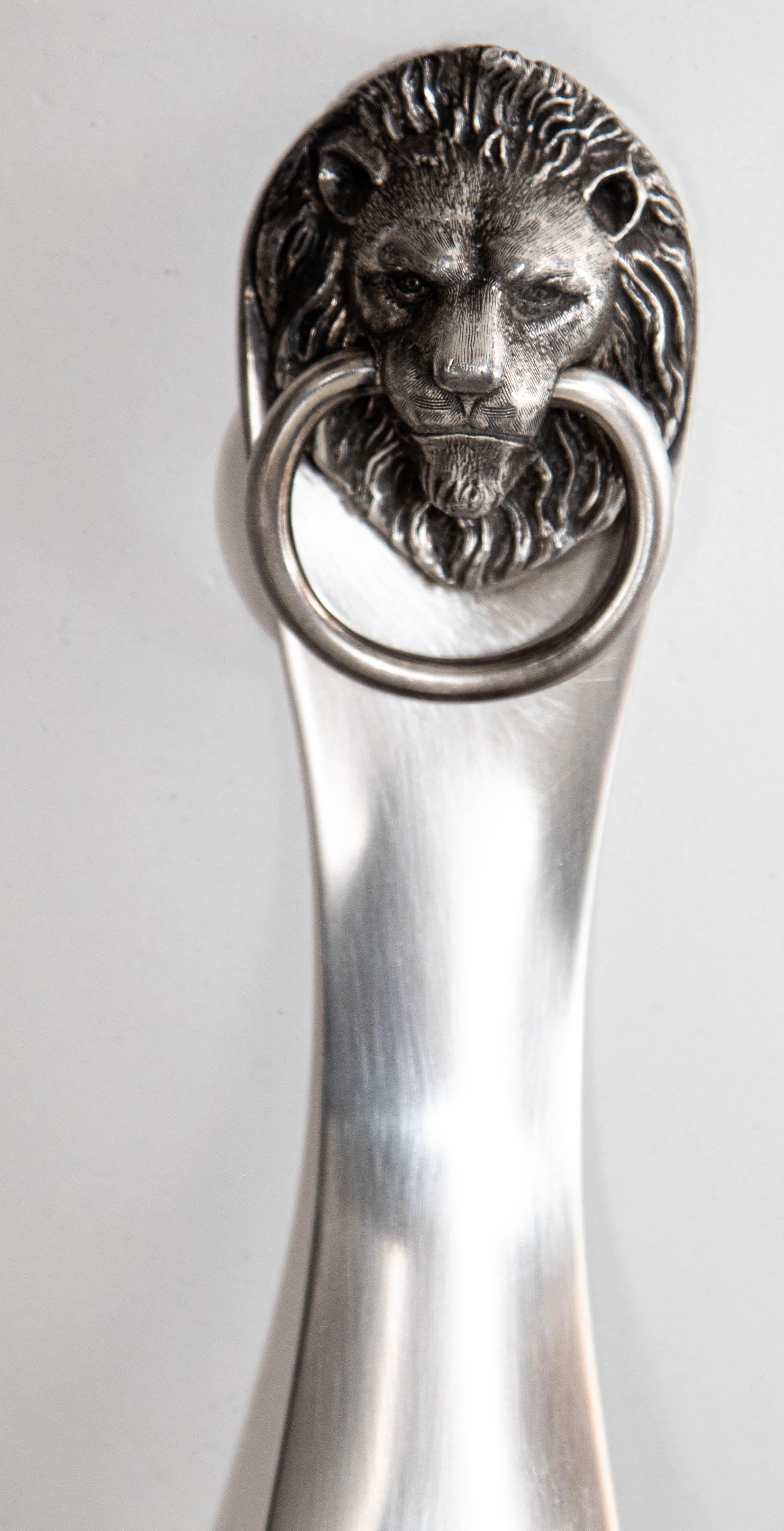 Antique 1950s Reed & Barton Silver Plated Shoe Horn with Lion head and Ring Handle.
Beautiful Reed & Barton heavy Lion head with ring in his mouth.
This cool shoe horn by Reed and Barton is finely made in polished silver plate featuring a lion mask