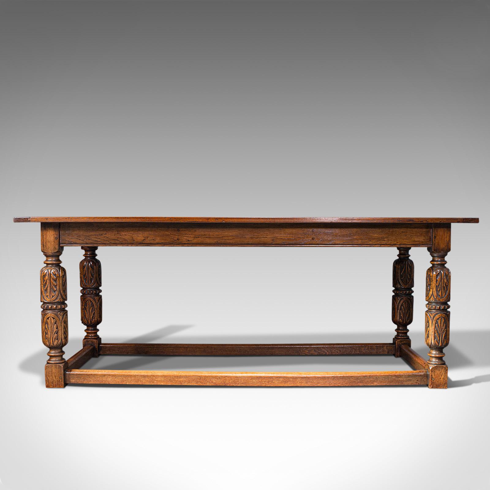 This is a large antique refectory table. An English, 6-8 seat oak dining table with Jacobean revival taste, dating to the Edwardian period, circa 1910.

Classic English country farmhouse form and Jacobean overtones
Displaying a desirable aged