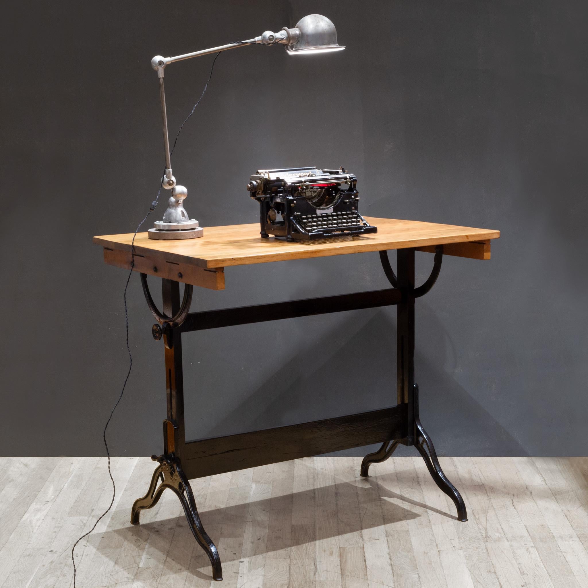 ABOUT

A fully adjustable industrial drafting table with solid wood top, cast iron and wood base and cast iron knobs. The table can be used as a tall dining table, desk or drafting table. The top swivels at any angle and from either side. The whole