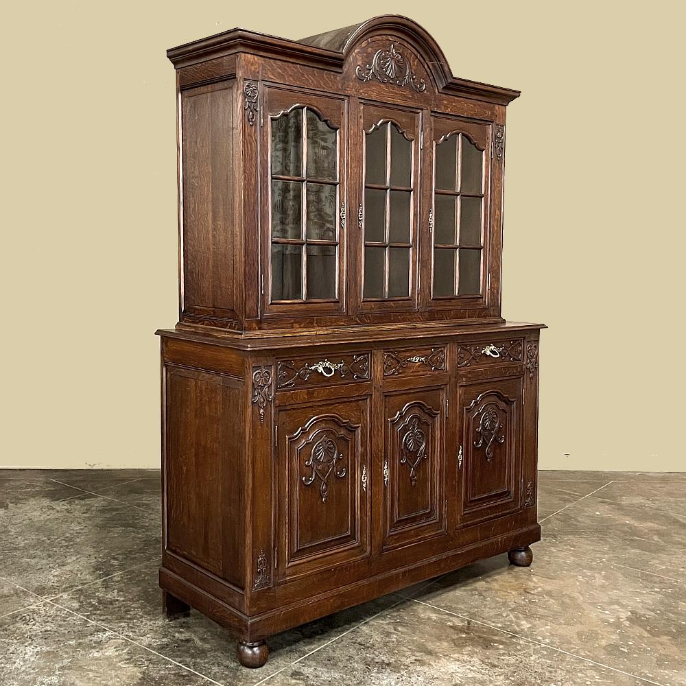 Antique Regence bookcase or display cabinet is an excellent choice for those who need storage, display and style flair in a relatively compact case. Not quite seven feet tall, it will fit in areas with beams, furdowns, staircases, etc. The design