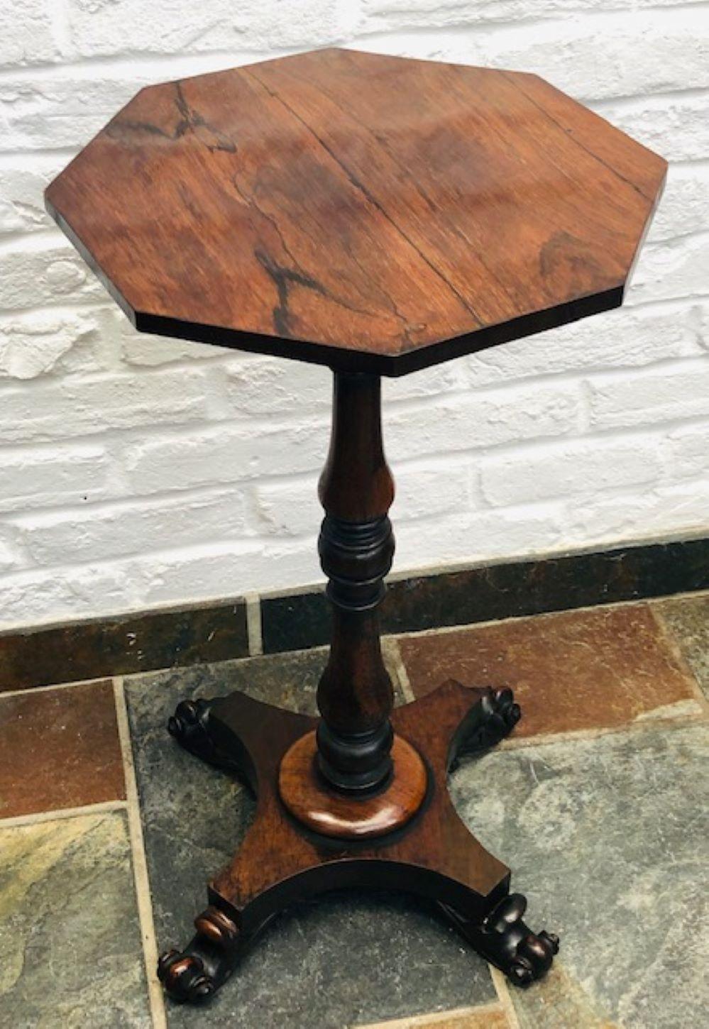 Antique Regency 19th cent octagonal rosewood wine table, English, 1820 

This is a very nice quality octagonal rosewood wine table, supported 
on a finely turned column supported by a quattro form base, ending in 
carved paw feet. Great colour