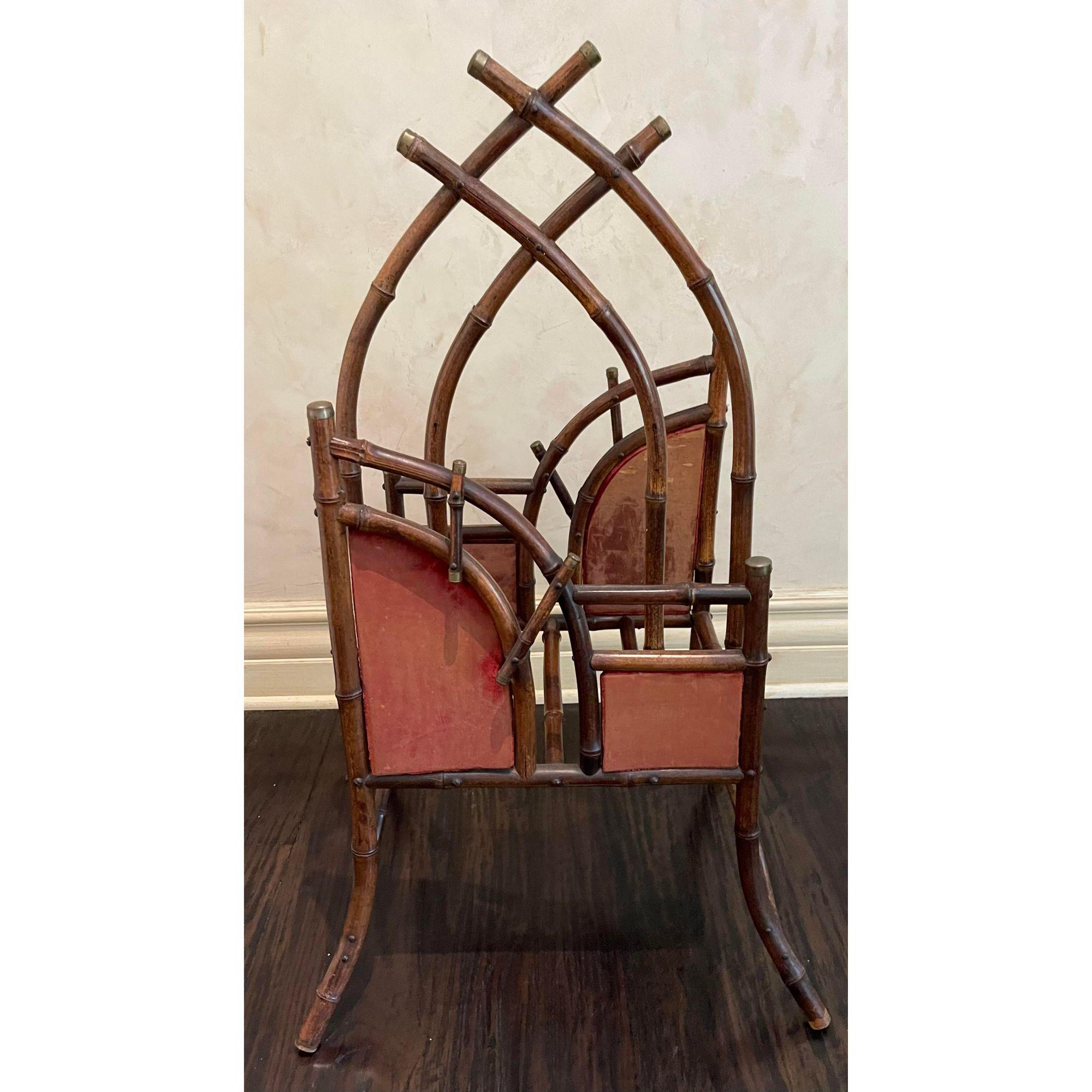 Antique Regency bamboo magazine rack. It has an unusual form and a beautiful patina.

Additional information: 
Materials: bamboo
Color: brown 
Period: 19th century
Styles: Regency
Item Type: vintage, antique or pre-owned
Dimensions: 21