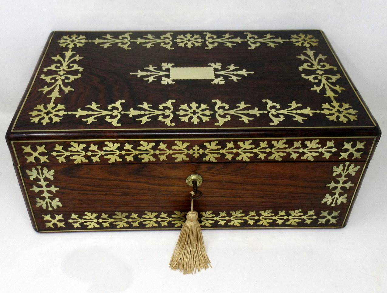 An exceptionally fine quality English well figured Mahogany ladies or gents travelling writing slope of outstanding quality, with lavish brass inlay decoration, twin polished brass carry handles, early 19th century, complete with original fitted