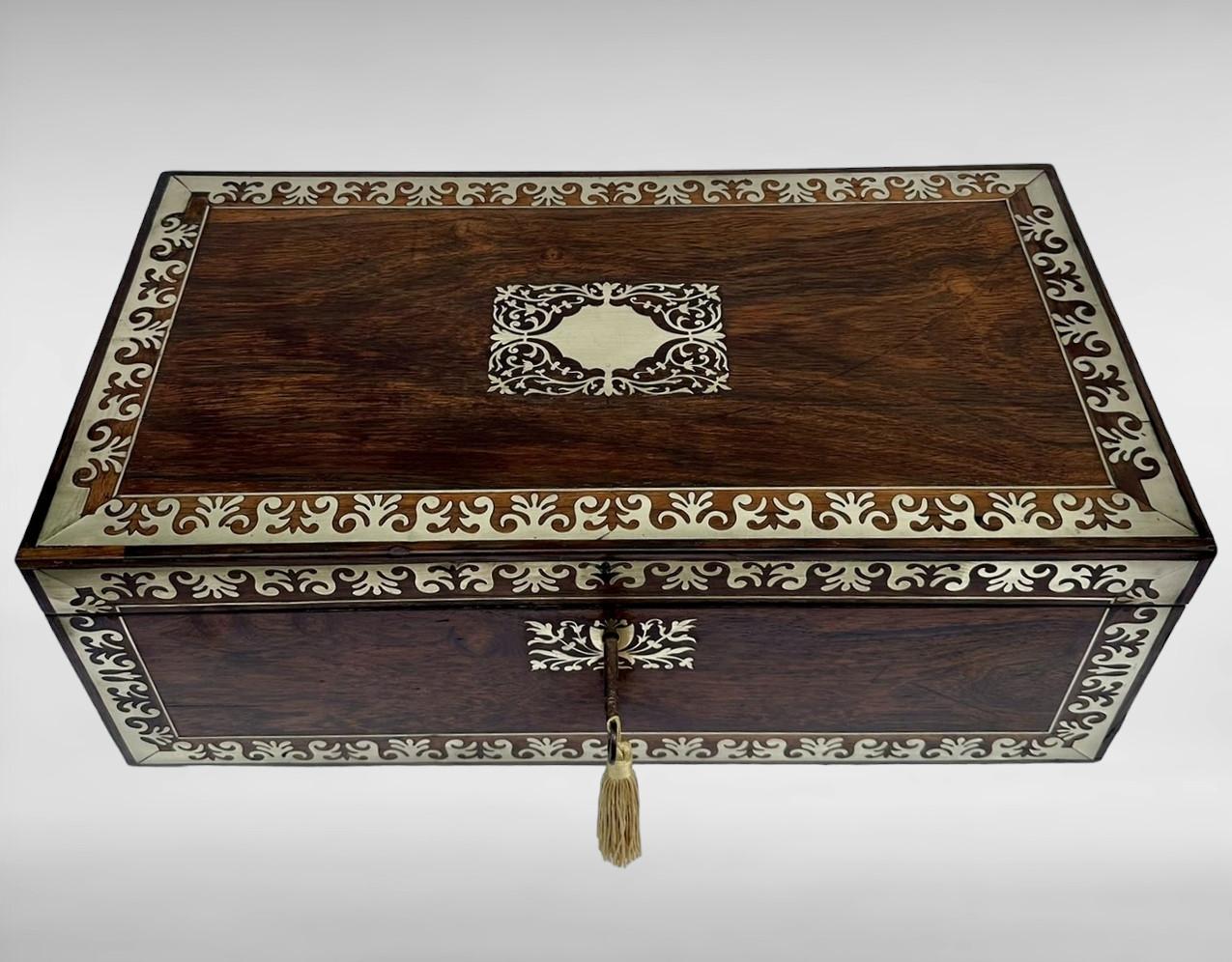 An Exceptionally Fine Quality English Well Figured Rosewood Ladies or Gents English Georgian Travelling Writing Slope of outstanding quality and unusually large proportions, with lavish brass inlay decoration, twin polished brass carry handles,