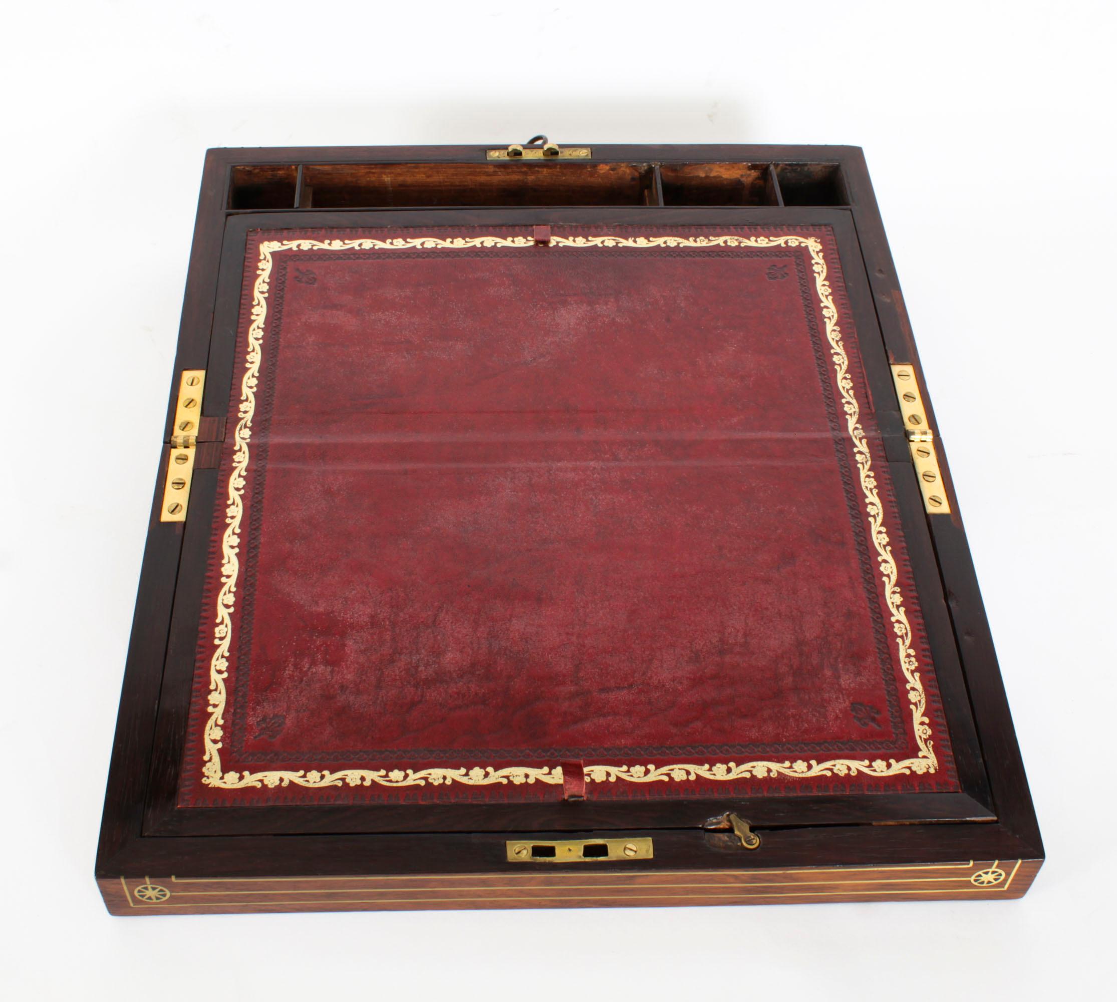 An elegant Regency brass mounted Gonçalo Alves campaign writing slope, circa 1820 in date.

The beautifully polished goncalo alves case has a wonderful age-related patina and a key lockable hinged top with inset brass beading and plaques,