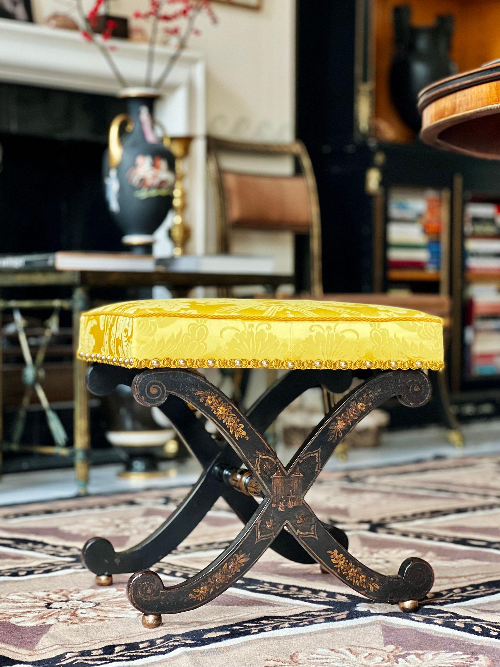 A rare early 19th century Regency period X-frame stool, after a design by Thomas Hope, retaining its original chinoiserie decoration and covered in imperial yellow 'Cathay' silk damask by Gainsborough Silk.
England, circa 1820.

Why we like it
A