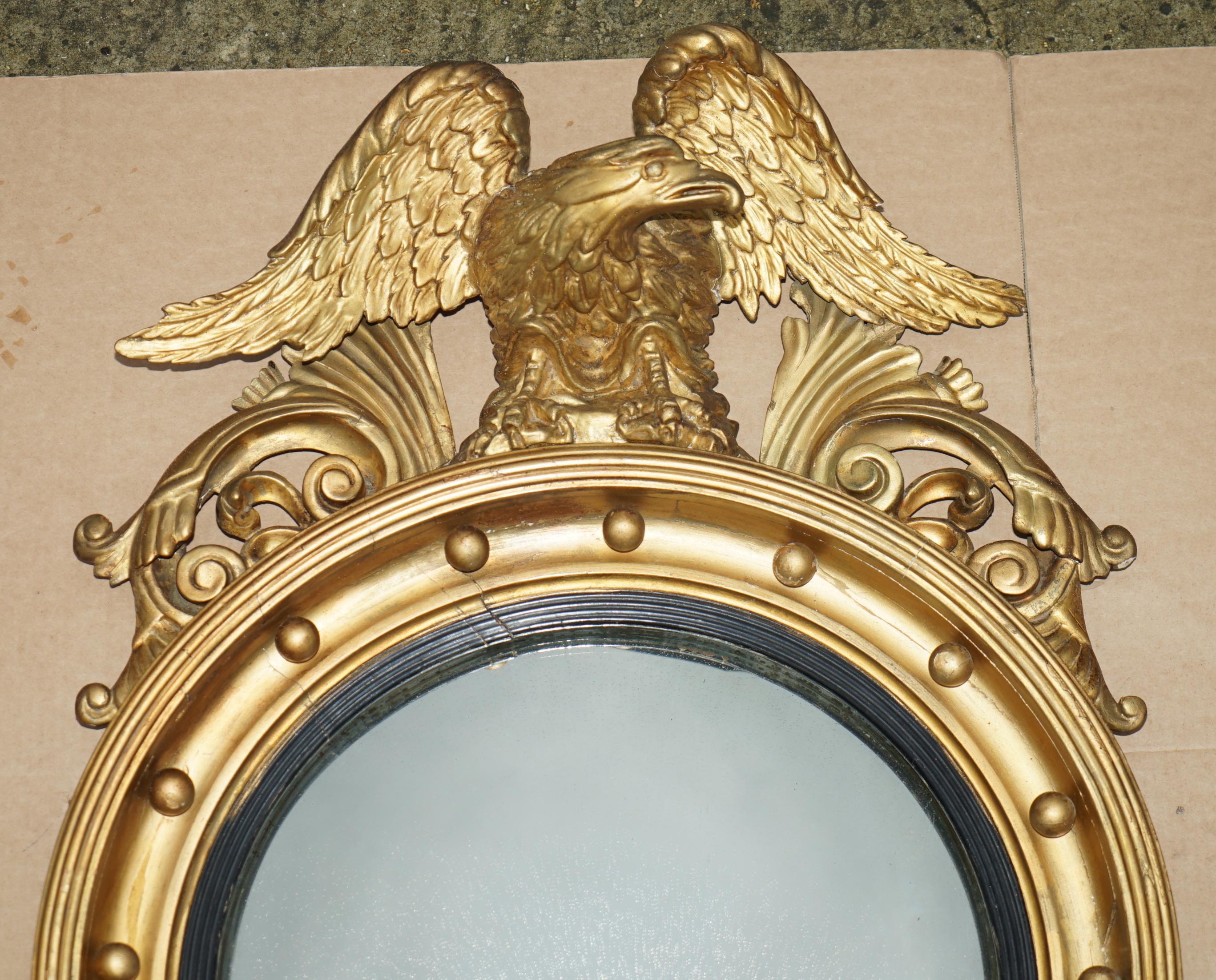 Royal House Antiques

Wimbledon-Furniture is delighted to offer for sale this super collectable fully stamped original Alban Vokins signed Regency Convex Bullseye wall mirror with large hand carved Eagle to the top 

Please note the delivery fee
