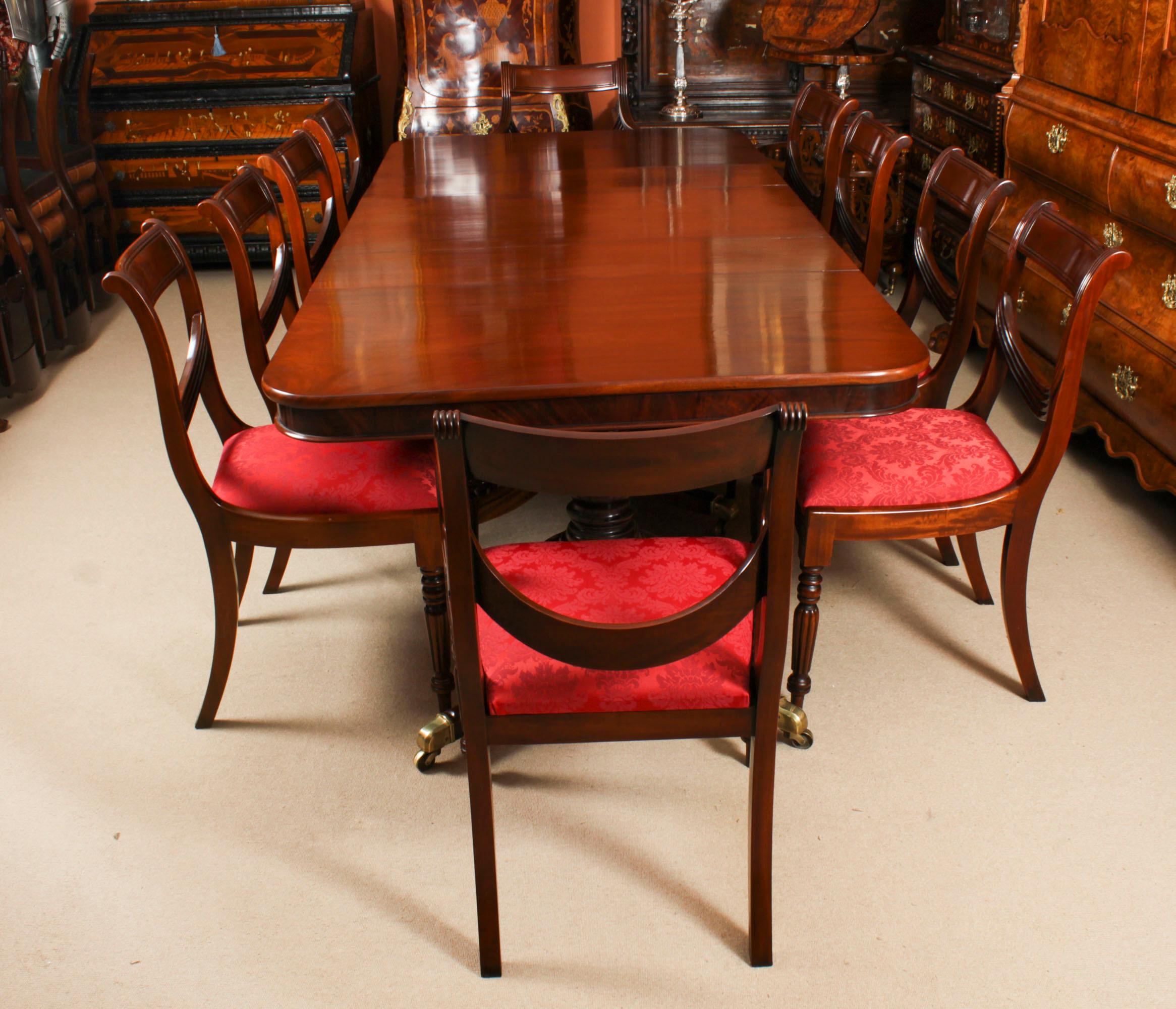 This is a fabulous high quality dining set comprising an antique flame mahogany Regency Period metamorphic triple pillar dining table Circa 1820 in date and a set of ten Regency Revival dining chairs.

The fabulous high quality antique flame