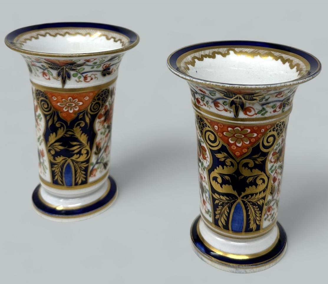 Wonderful Rare identical Pair of Early English Regency Royal Crown Derby Porcelain Flared Rim Vases of traditional form. First quarter of the Nineteenth Century. 

Lavishly hand decorated in the traditional Imari palette with colours of Iron Red and
