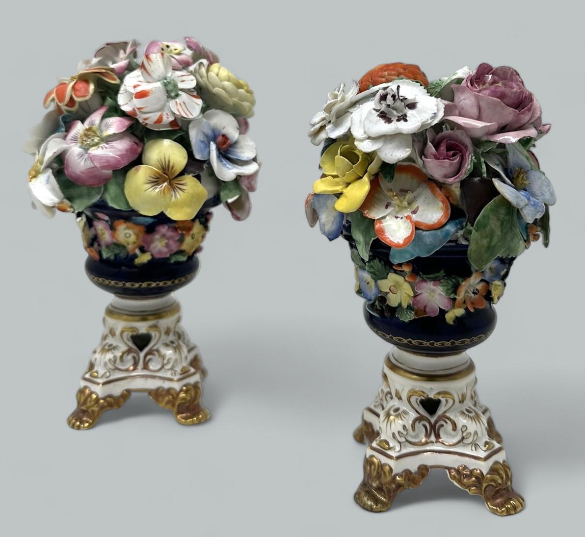 Wonderful Rare Pair of Early English Regency Royal Crown or Bloor Derby Porcelain Vases. First quarter of the Nineteenth Century. 

Each vase lavishly hand decorated with Summer Flowers of Roses, Carnations, Primula and others above waisted formed
