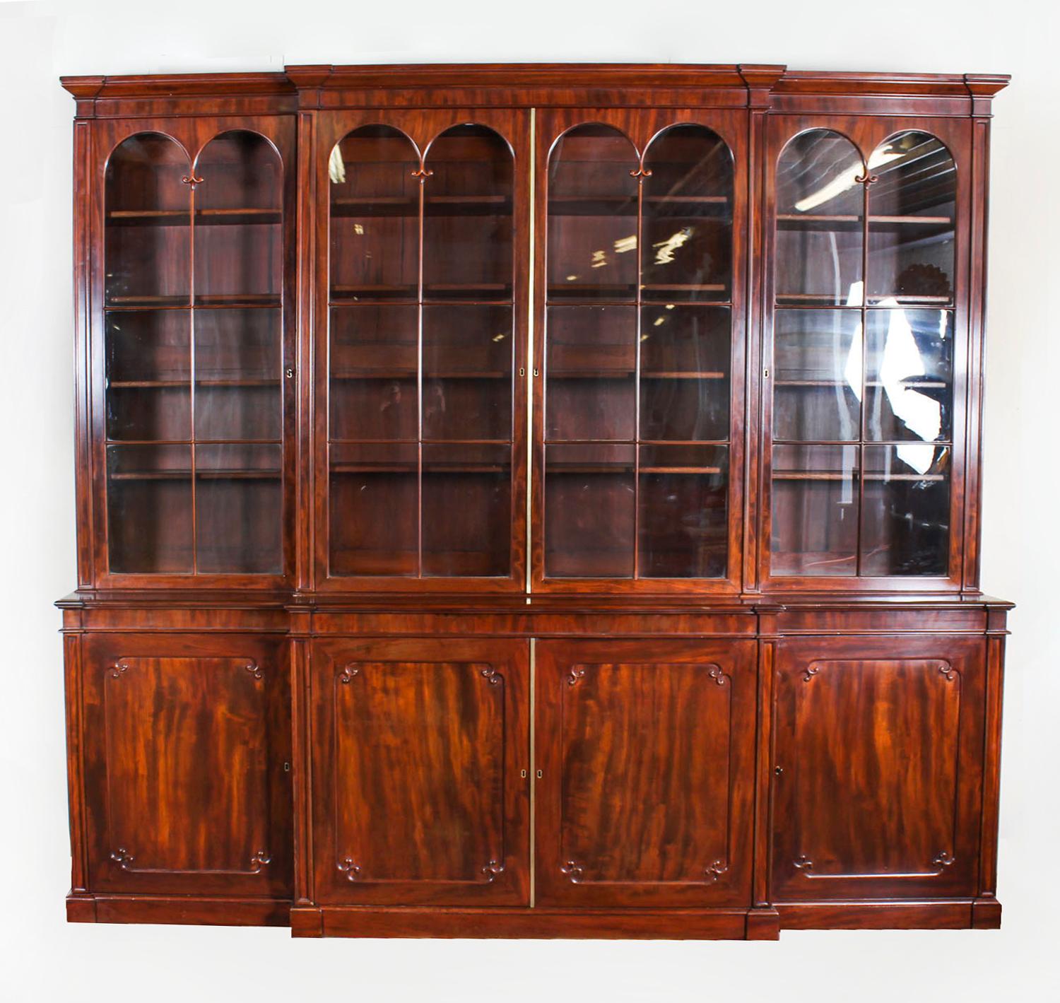 English Antique Regency Flame Mahogany Four Door Breakfront Bookcase, 19th Century