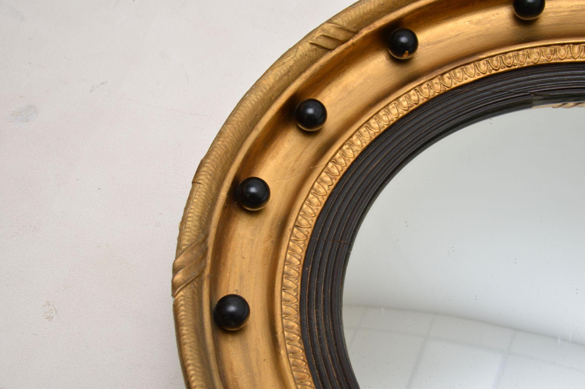 Early 19th Century Antique Regency Gilt Wood Convex Eagle Mirror