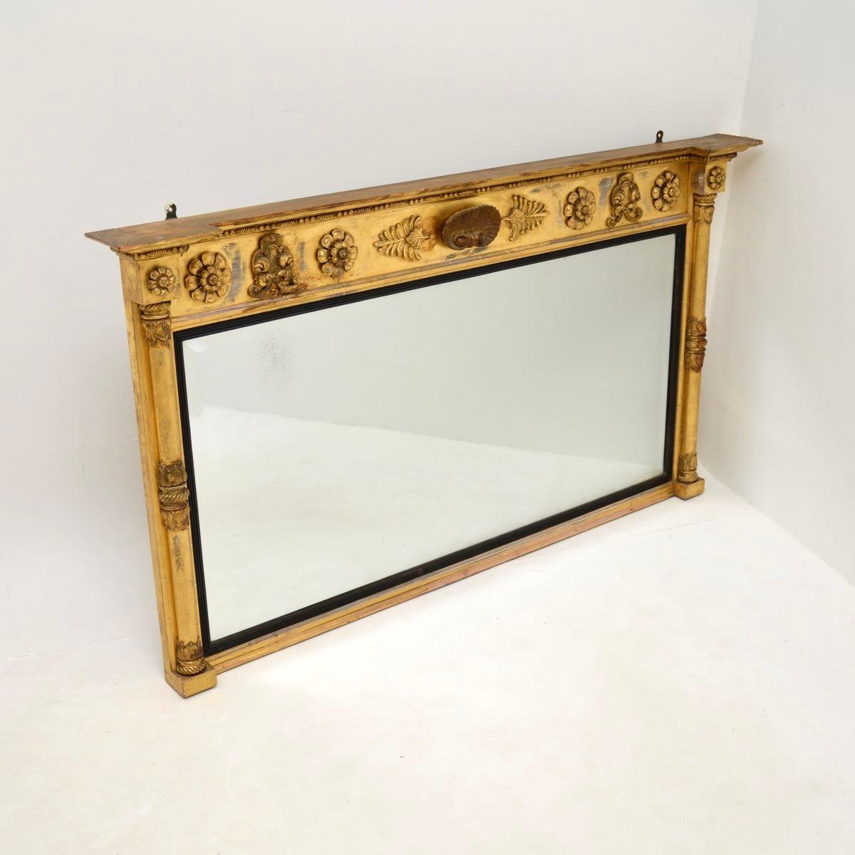 Eine atemberaubende antike Regency vergoldetem Holz über Mantel Spiegel. Sie wurde in England hergestellt und stammt aus der Zeit um 1830-40.

Die Qualität ist hervorragend, das Design ist schön und ungewöhnlich. Es gibt ein beeindruckendes