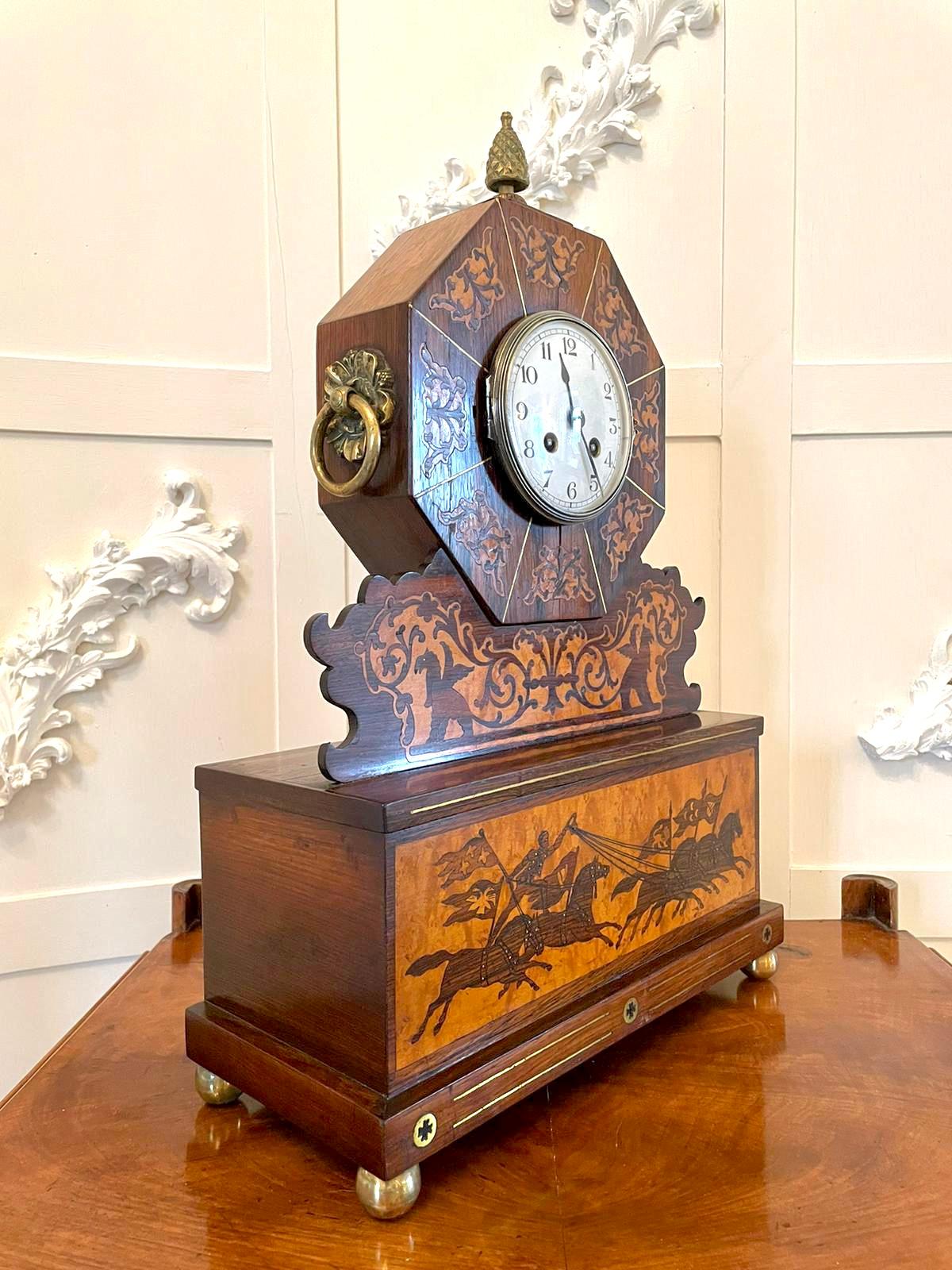 Fine antique Regency inlaid marquetry mantel clock having an outstanding inlaid marquetry case, octangular shaped top with pretty ornate brass mounts, brass bezel, porcelain dial with original hands, eight day movement striking on the hour and half