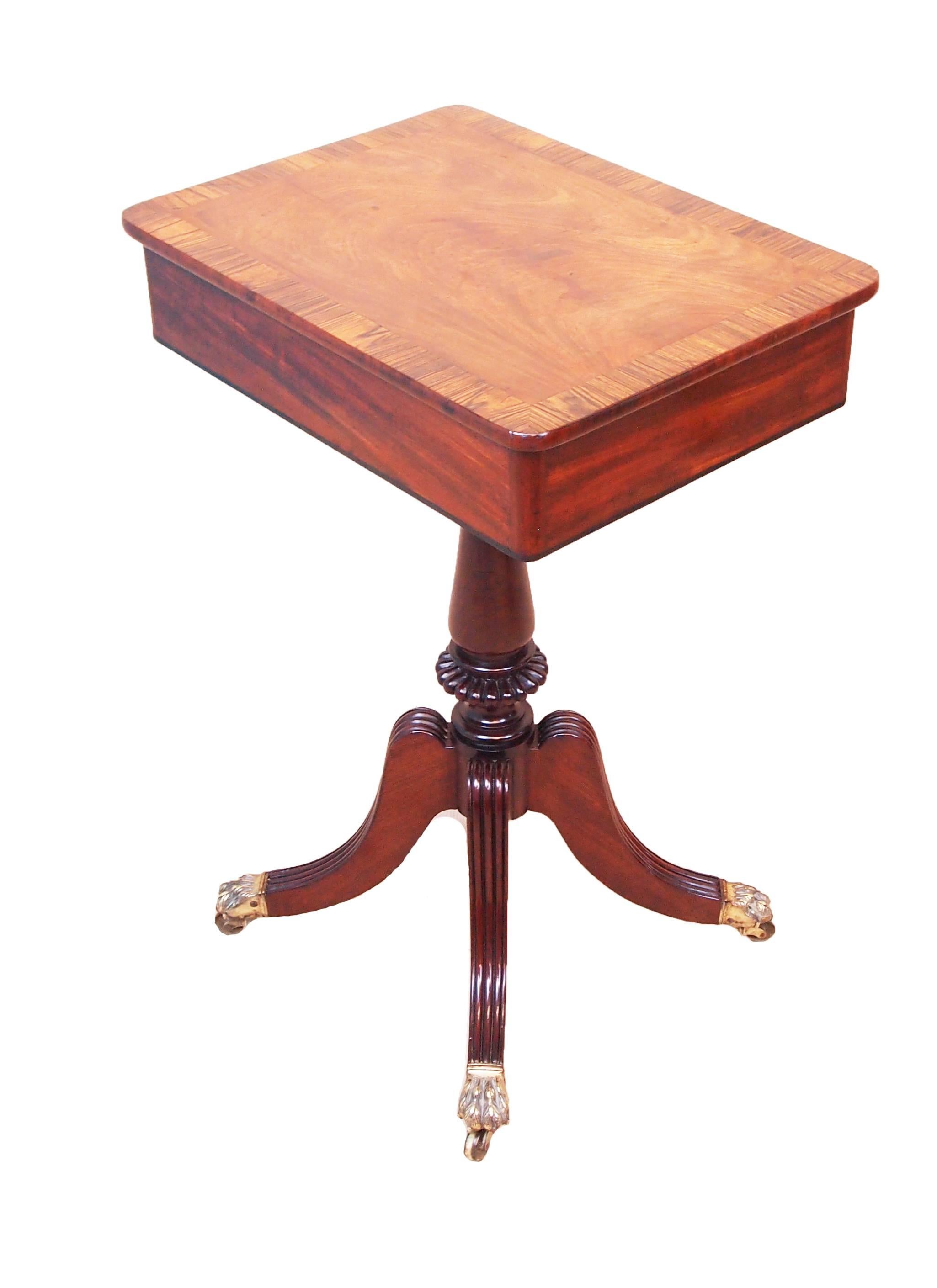 A very good quality Regency period mahogany lamp table having
superbly figured and crossbanded oblong top with one drawer to
frieze raised on elegant turned central column and four splayed
legs with original brass castors.