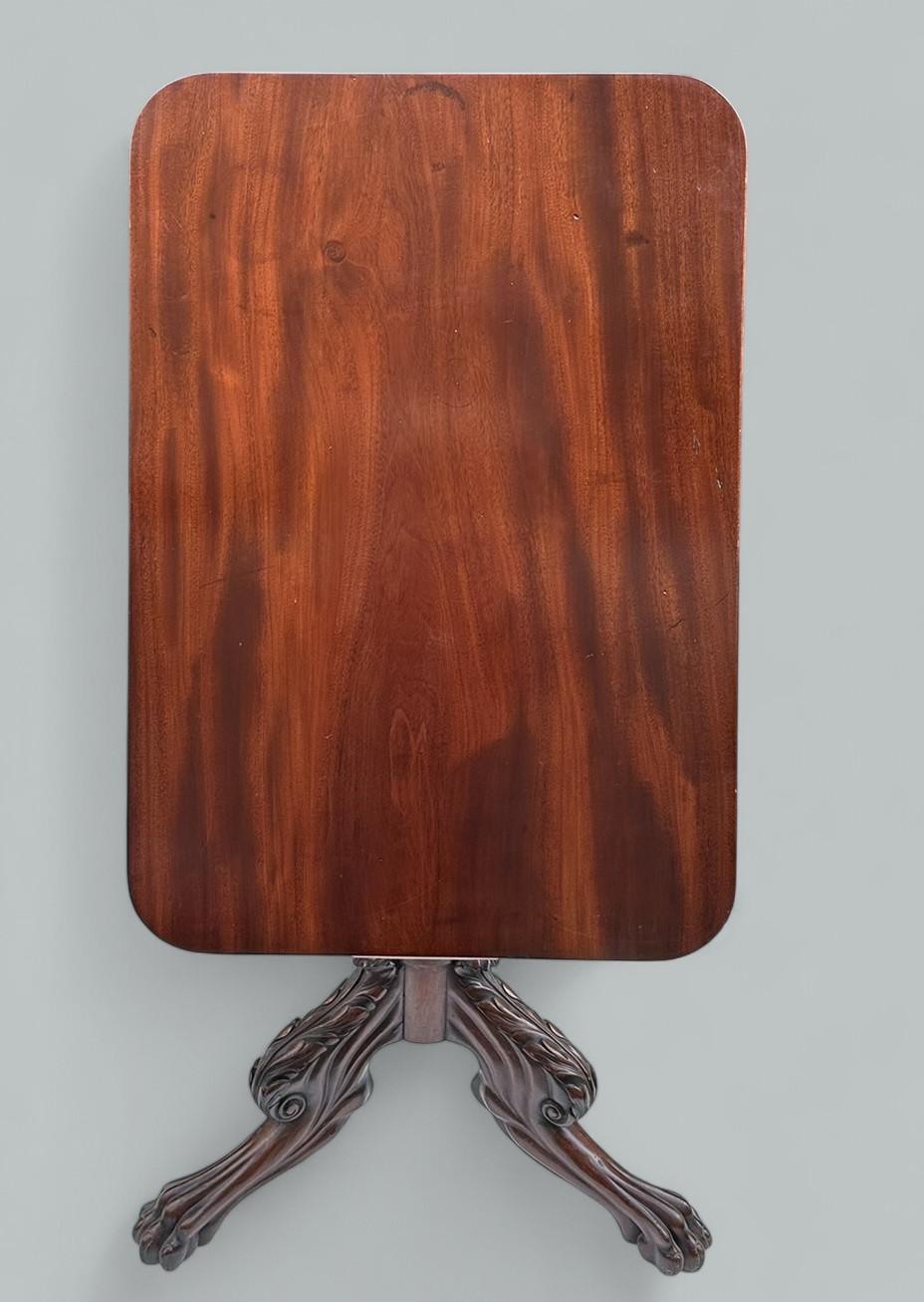 A Very Imposing example of an English well figured Mahogany late Regency Period snap-top Occasional Table of small proportions, in our opinion is of Irish Manufacture. Circa 1815-20. 

The tilt up rectangular surface with rounded corners locks