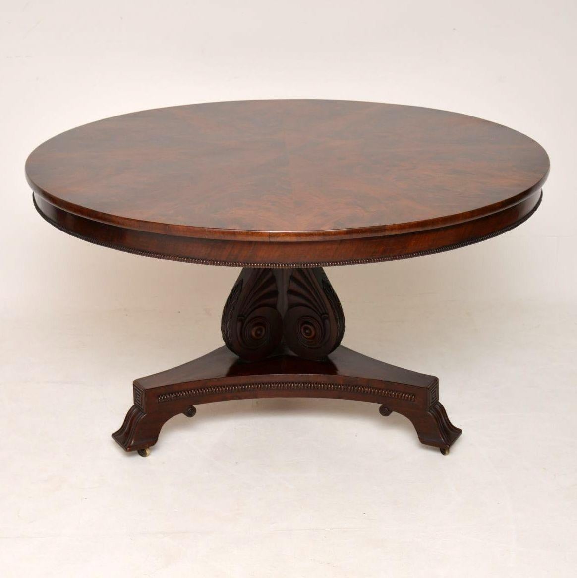 This antique Regency circular dining table is extremely high quality and has some wonderful designs on the table top, plus on the base. It’s in excellent original condition and dates from the 1820s-1830s period. The table top is flat, free from