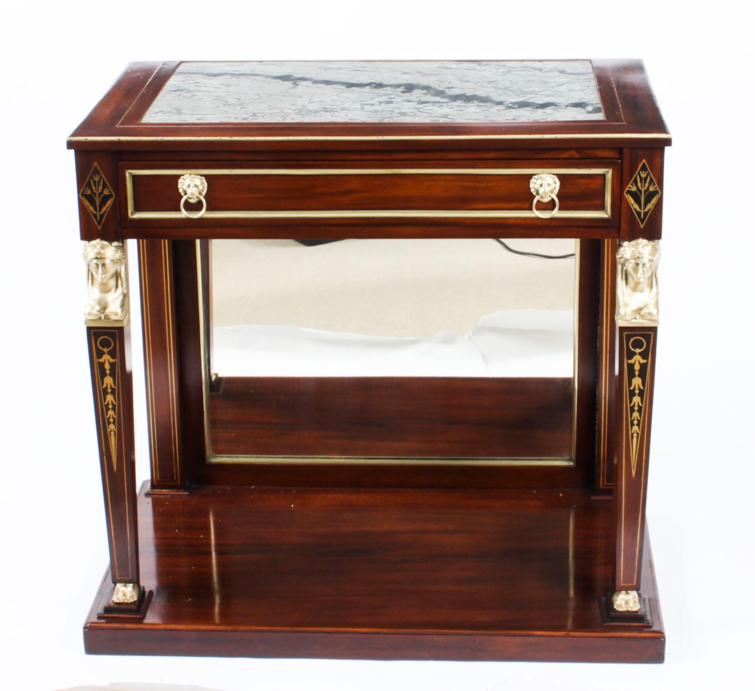 This is an elegant antique English Regency mahogany and ormolu mounted console table with inset marble top, circa 1820 in date.

This magnificent console table has beautiful decorative brass inlaid lozenges and ormolu Egyptian revival neo-classical
