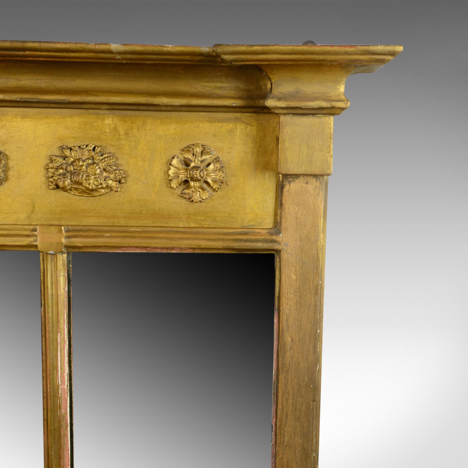 This is an antique overmantel mirror. An English Regency, early 19th century, wall mirror for the hall or drawing room divided as with a triptych, circa 1820.

Attractive, mellow golden tones in the giltwood frame
A quality mirror from the