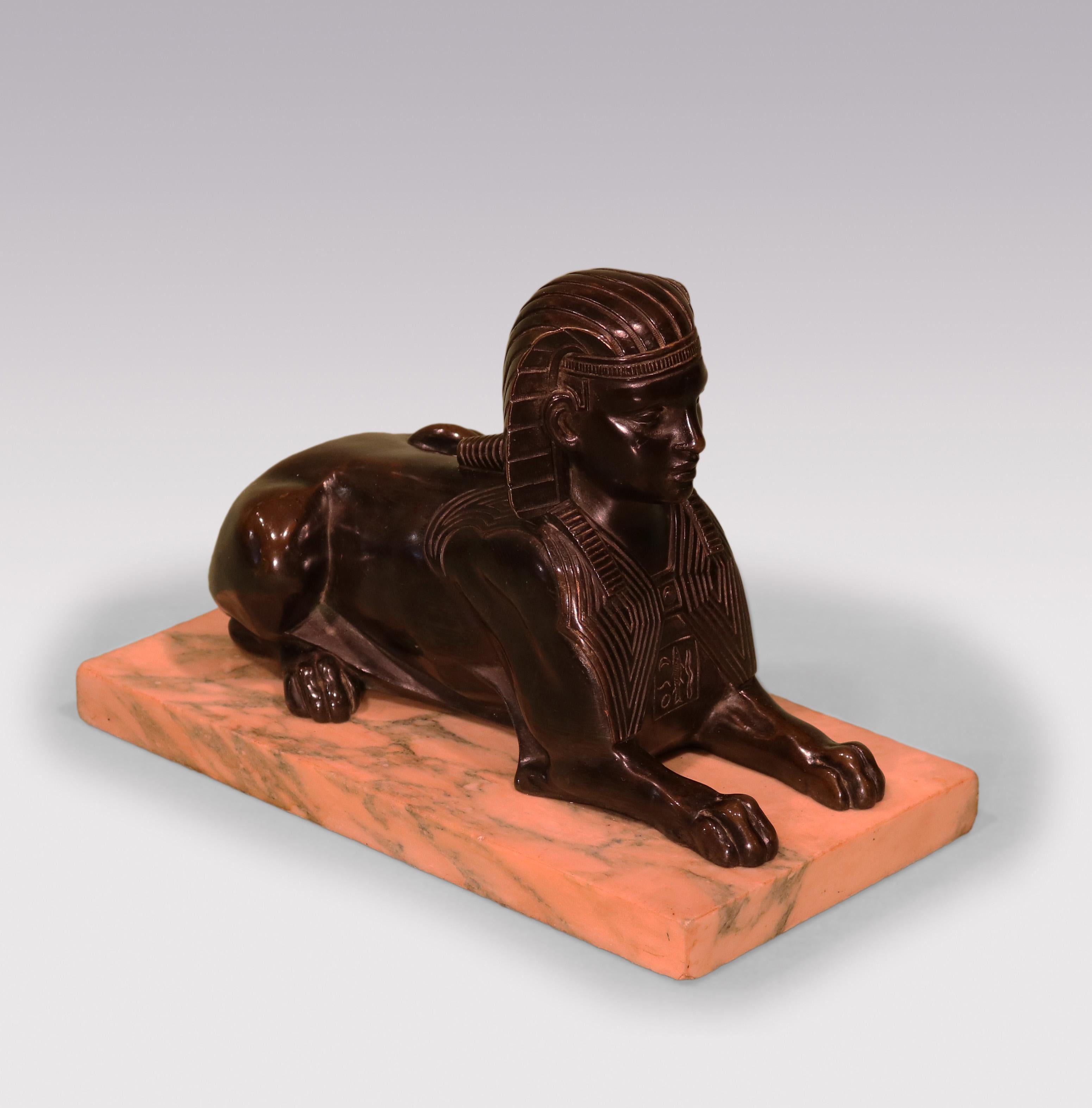 A mid-19th Century well-cast Model of the Sphinx of Giza mounted on veined marble base.