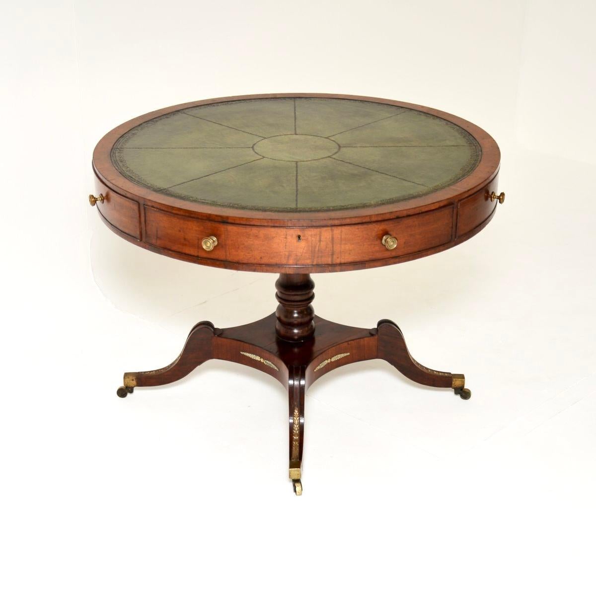 An exceptional original antique Regency period leather top drum table. This was made in England, it dates from around the 1800-1820 period.

It is of very fine quality, it is a large and impressive size. There are four drawers with original locks,