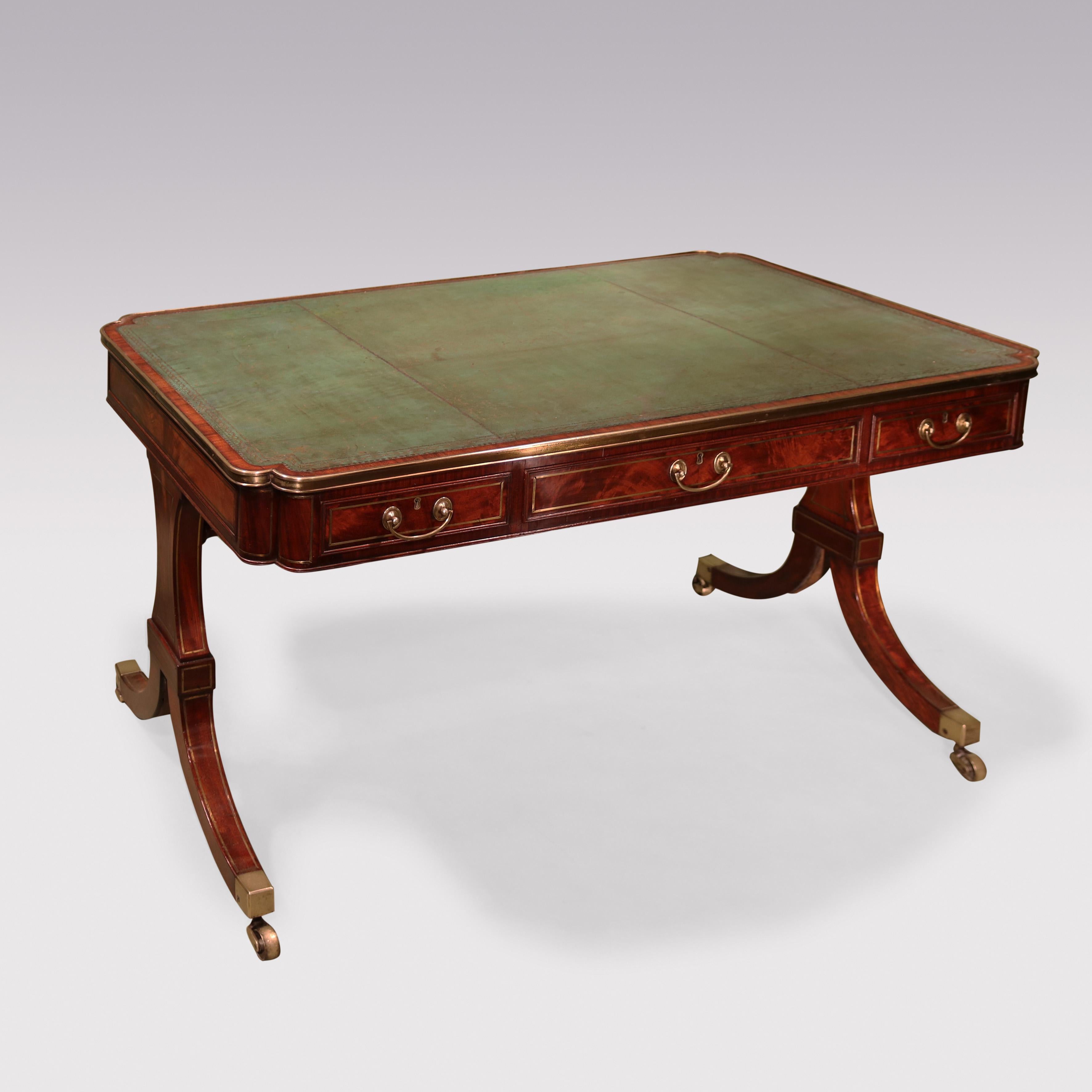A fine quality early 19th century Regency period mahogany end support writing table, having brass line inlay throughout.  The table having a green tooled leather writing surface with gilt brass edging  and double lobed corners, fitted with six