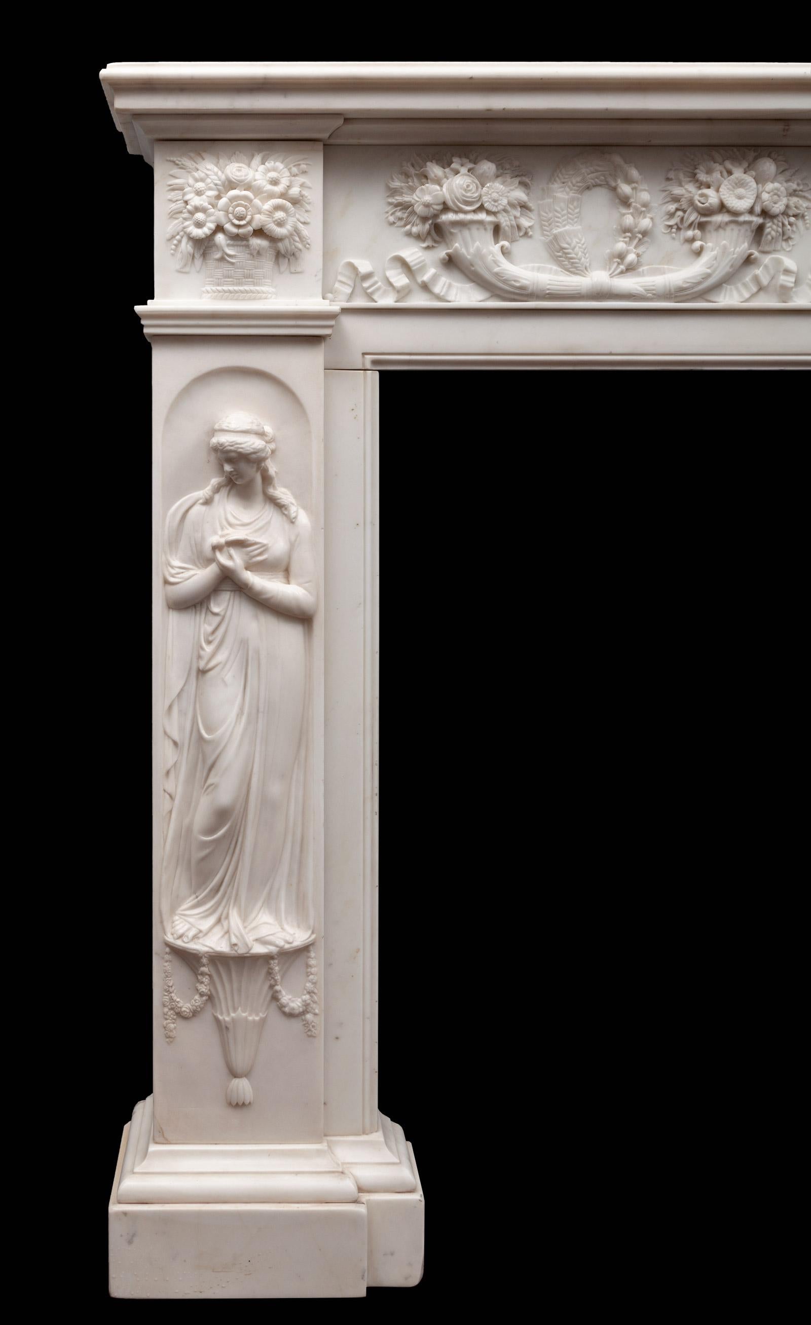 An outstanding and beautifully carved antique white statuary marble fireplace. The deep rectangular moulded shelf, rests on a frieze exquisitely carved with two pairs of cornucopias, centred by a classical scene depicting Cupid and Psyche. Each jamb