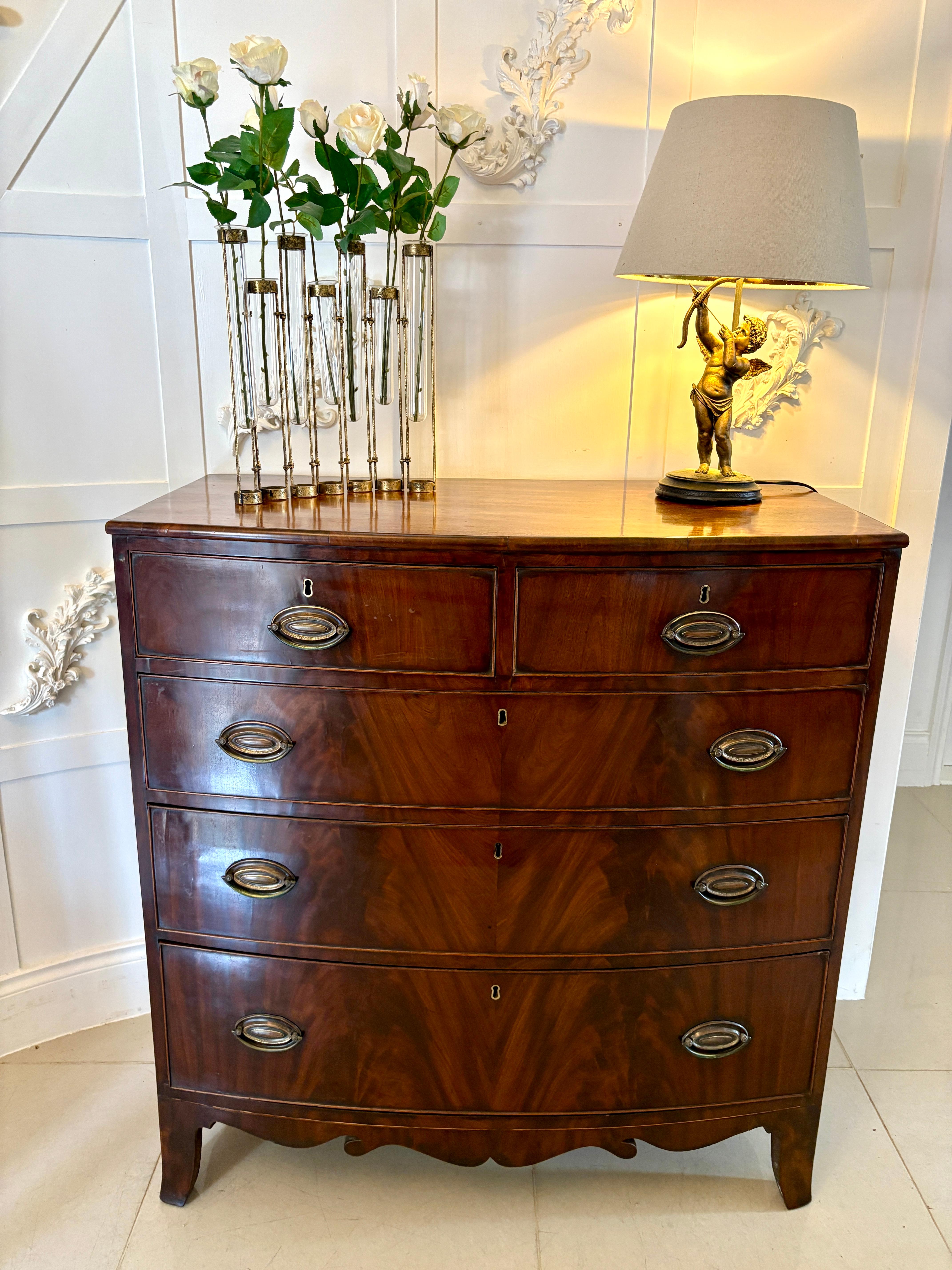 Antique Regency quality figured mahogany bow fronted chest of 5 drawers having a quality figured mahogany bow front top above 2 short and 3 long cockbeeded oak lined drawers with original brass handles standing on original splayed bracket feet