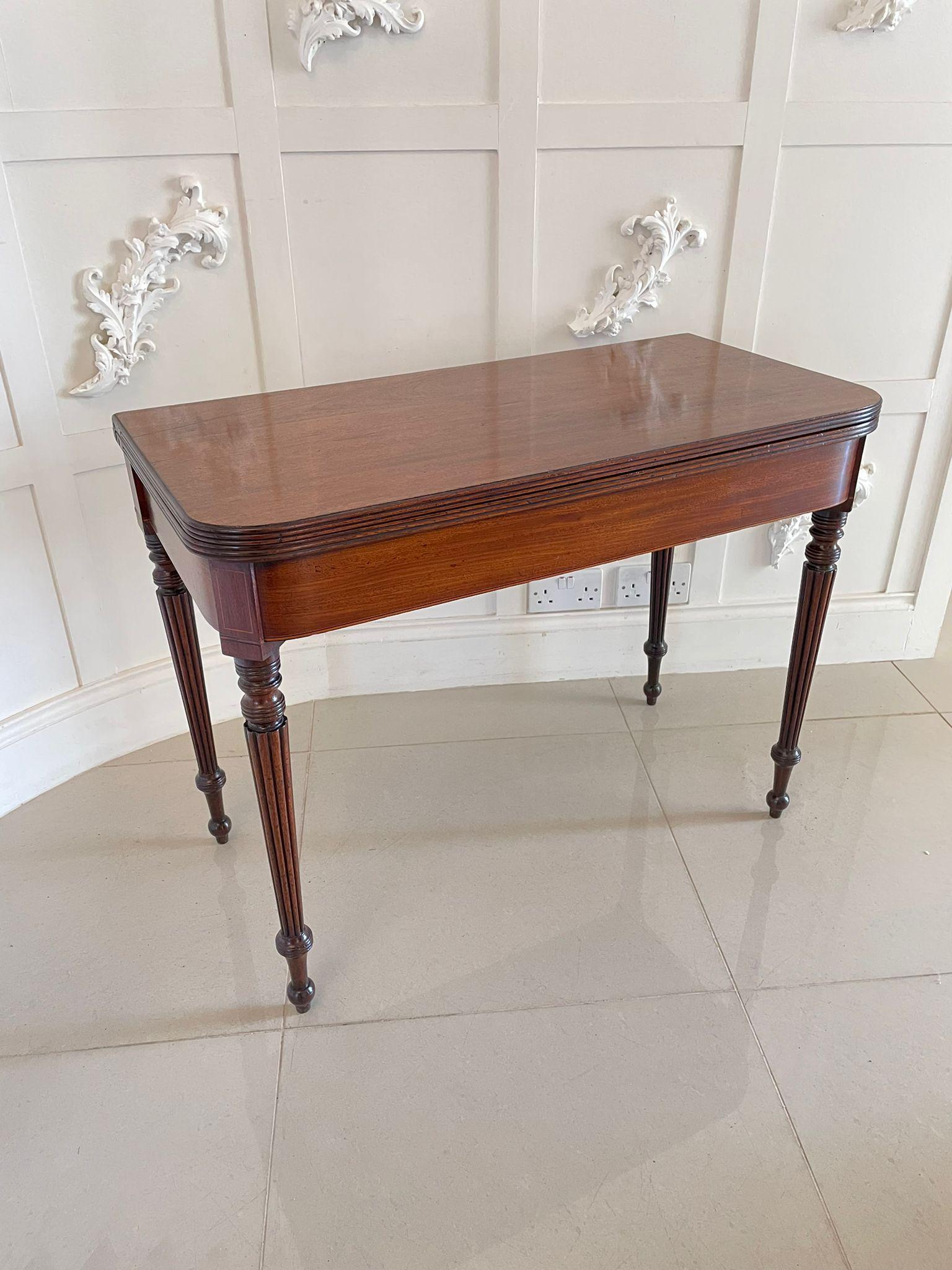 Antique regency quality mahogany card/side table having a quality mahogany top with a reeded edge opening to reveal the original baize interior, mahogany frieze with inlaid satinwood stringing and standing on four quality mahogany reeded tapering
