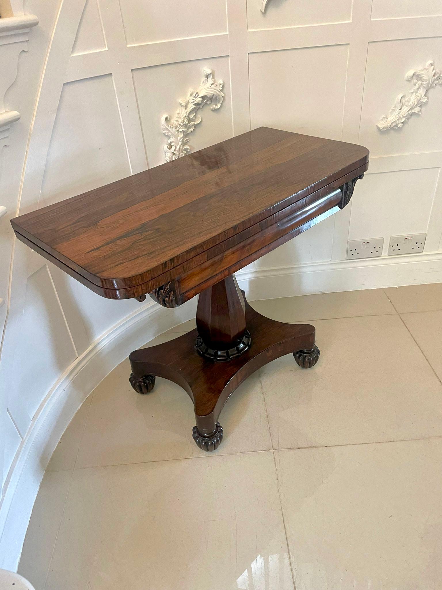Antique Regency quality rosewood tea/console table having a quality rosewood swizzle top opening to reveal a lovely polished interior, shaped carved frieze supported on a pear shaped pedestal column with a carved collar standing on a shaped platform