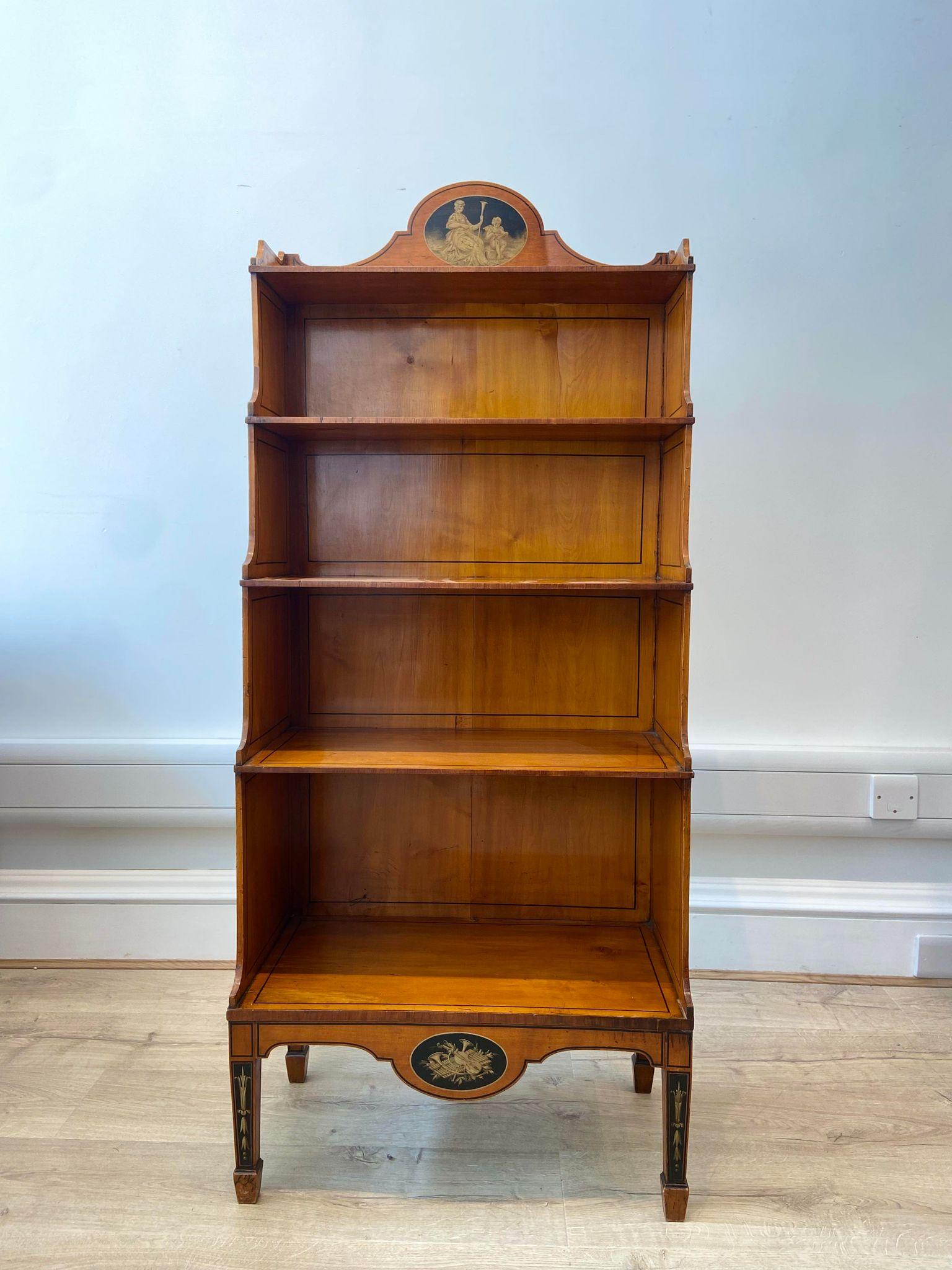 A beautiful and rare antique Regency satinwood free standing shelving unit, circa 1800 

Featuring 4 shelves and fine hand painted details. 

This piece was purchased via Asprey & Company in 1985 with receipt available - valuing the item at £4,500.