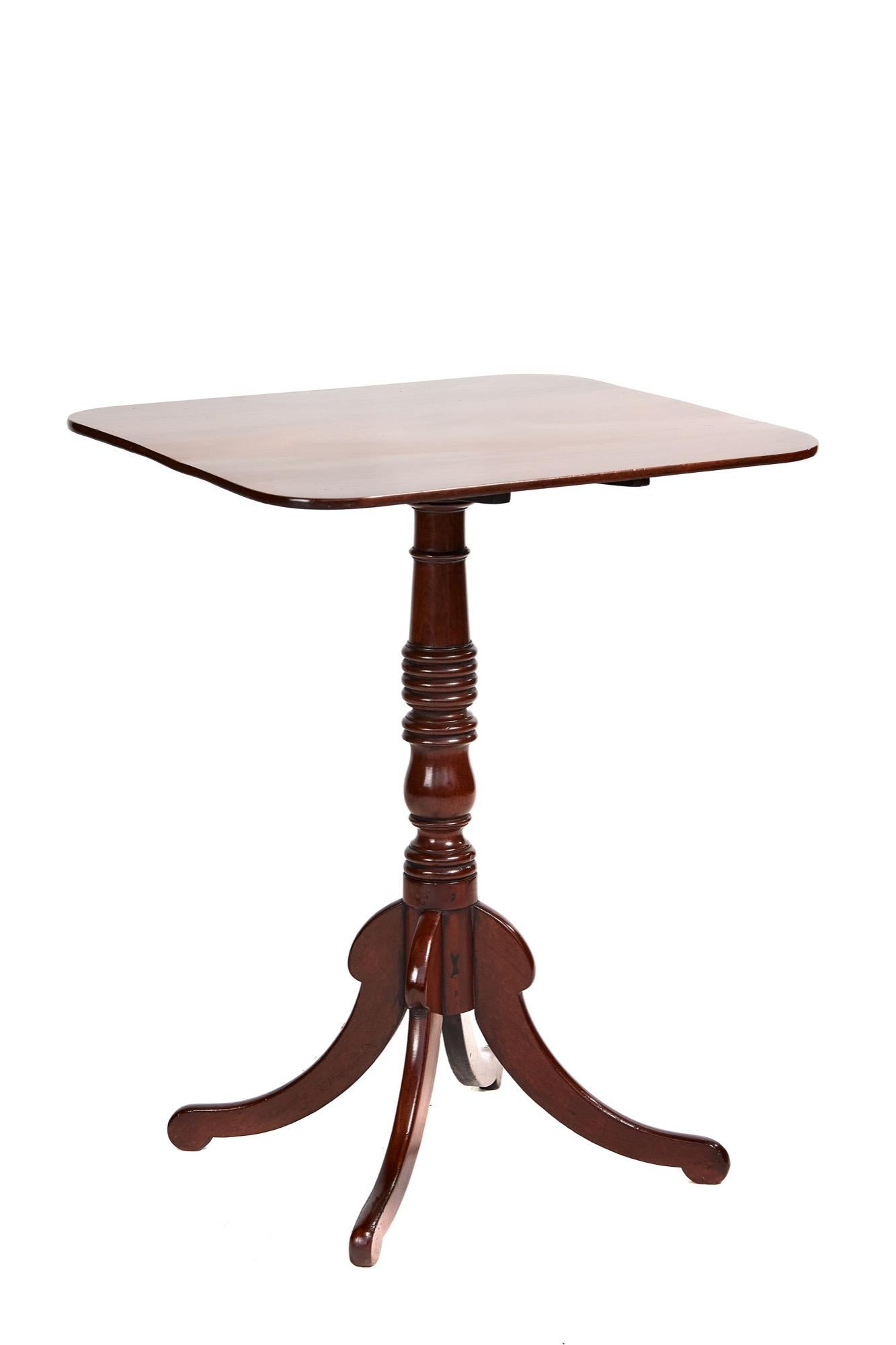 Antique Regency square mahogany tilt top table having a fantastic square mahogany top with very desirable aged patination and color, elegant turned mahogany column and terminating in four mahogany shaped splayed legs.

A terrific original example in
