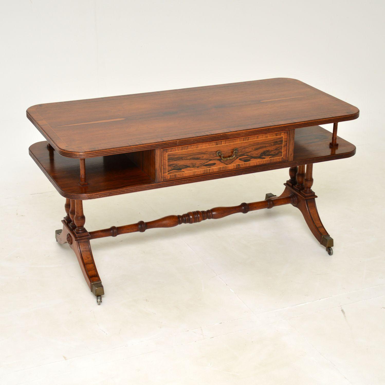 A stunning antique coffee table in the Regency style. This was made in England, it dates from around the 1930’s.

The quality is amazing, and it is very rare to see a model like this in such beautiful wood. The design is very stylish, the colour