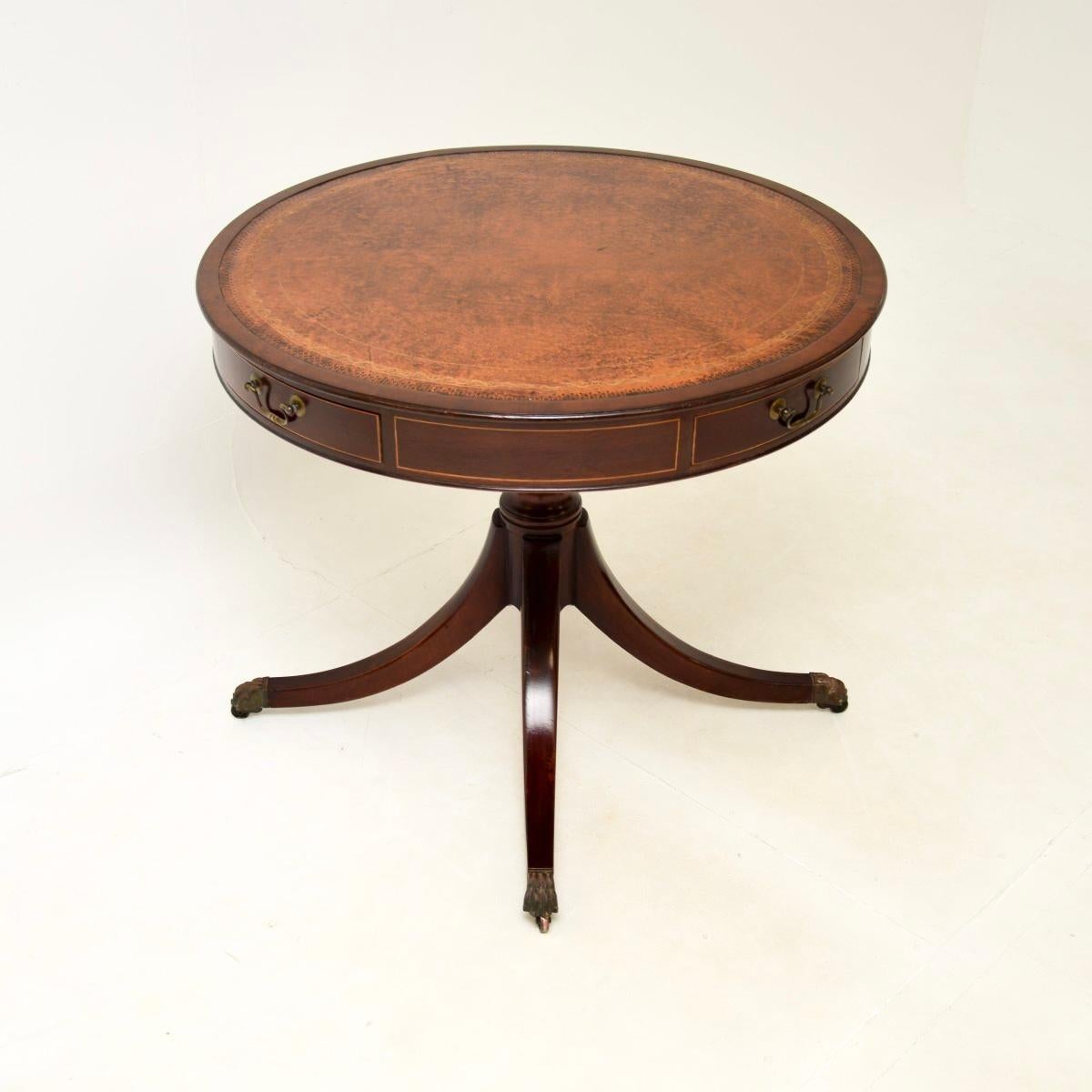 A superb antique Regency style leather top drum table with satinwood inlays, dating from around the 1930’s period.

The quality is superb, this is really well made and has a gorgeous design. There is a beautiful hand coloured gold tooled leather