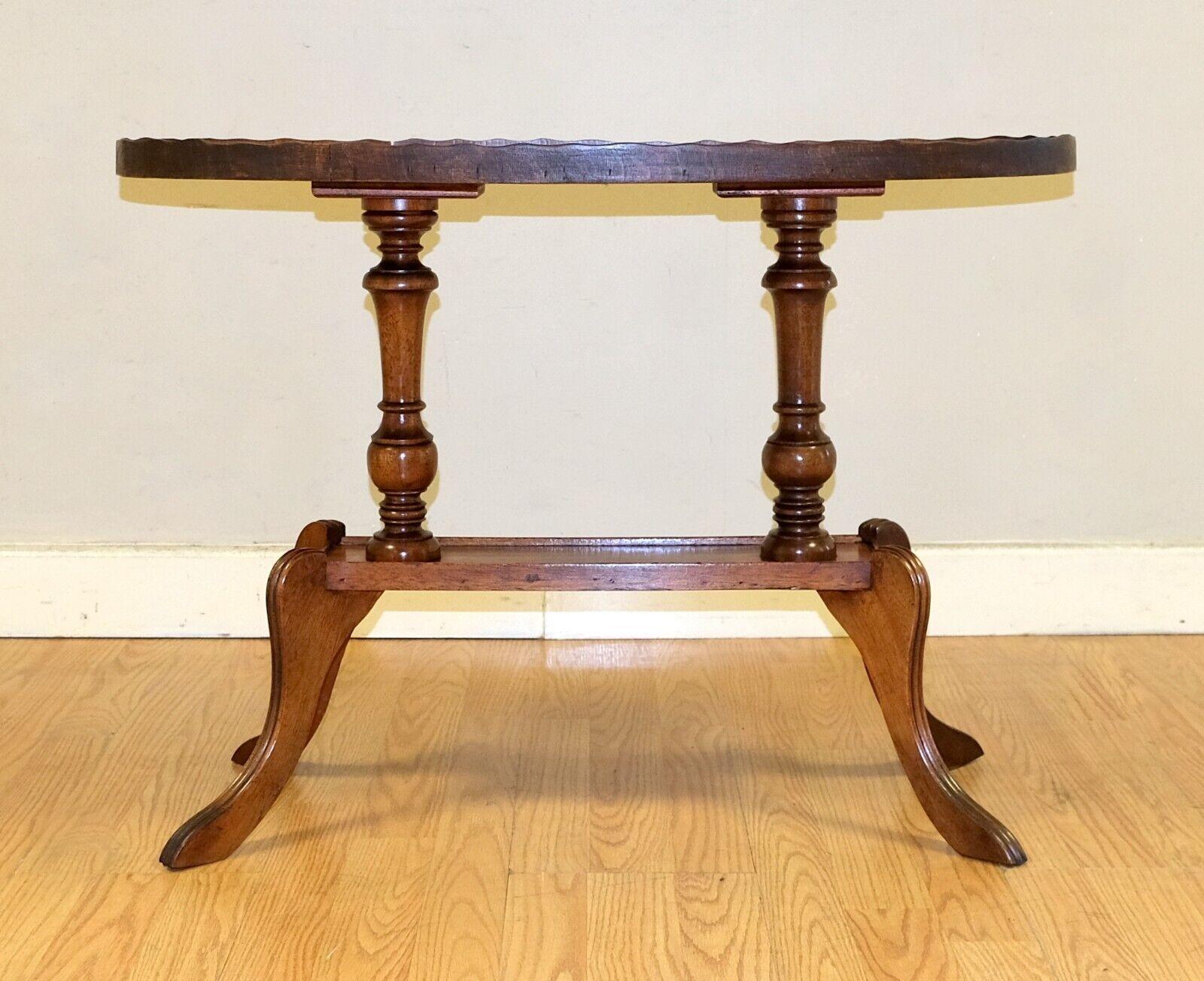 Hand-Crafted Antique Regency Style Oval Yew Wood Pie Crust Edge Coffee Table on Sabre Feet For Sale