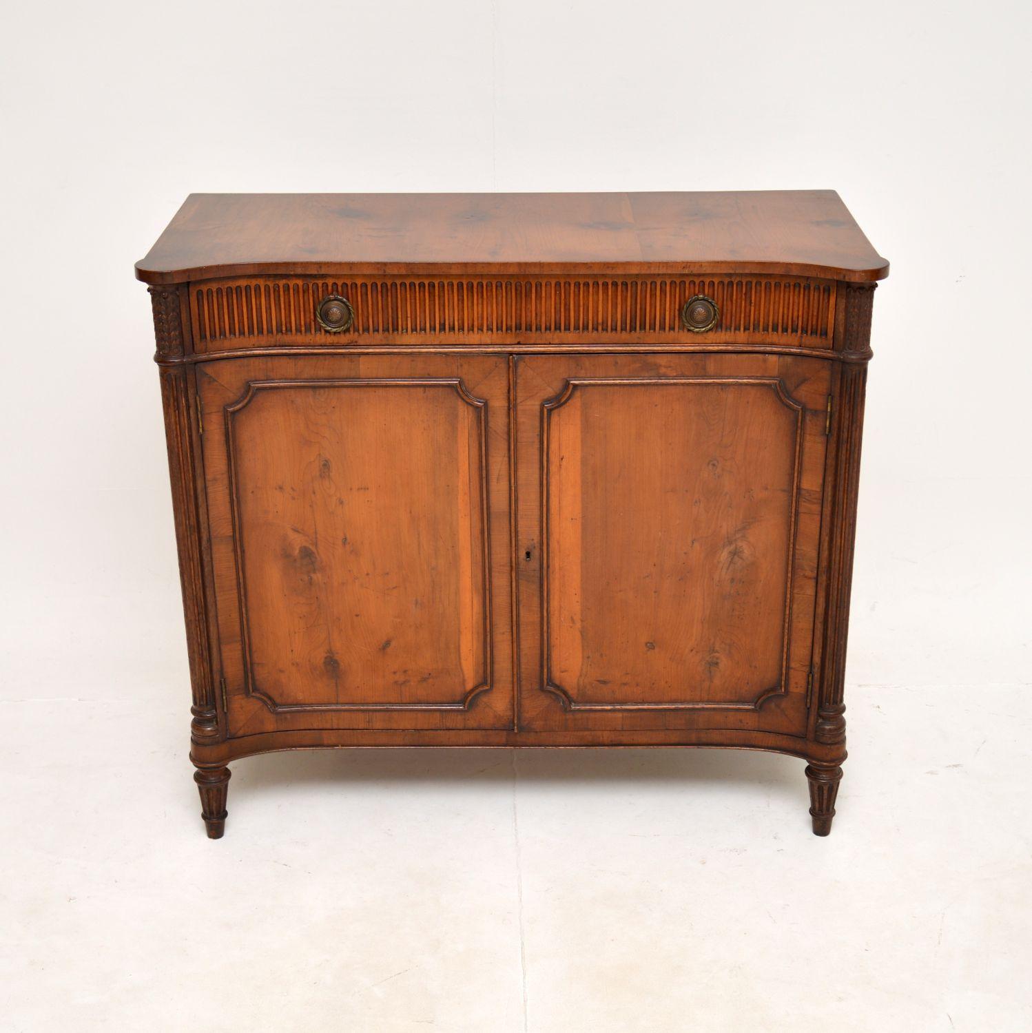 A beautiful antique Regency Style period yew wood cabinet. This was made in England, it dates from around the 1920’s period.

The quality is outstanding, this is very well made and is also a very useful size. The two panelled doors contain a cabinet