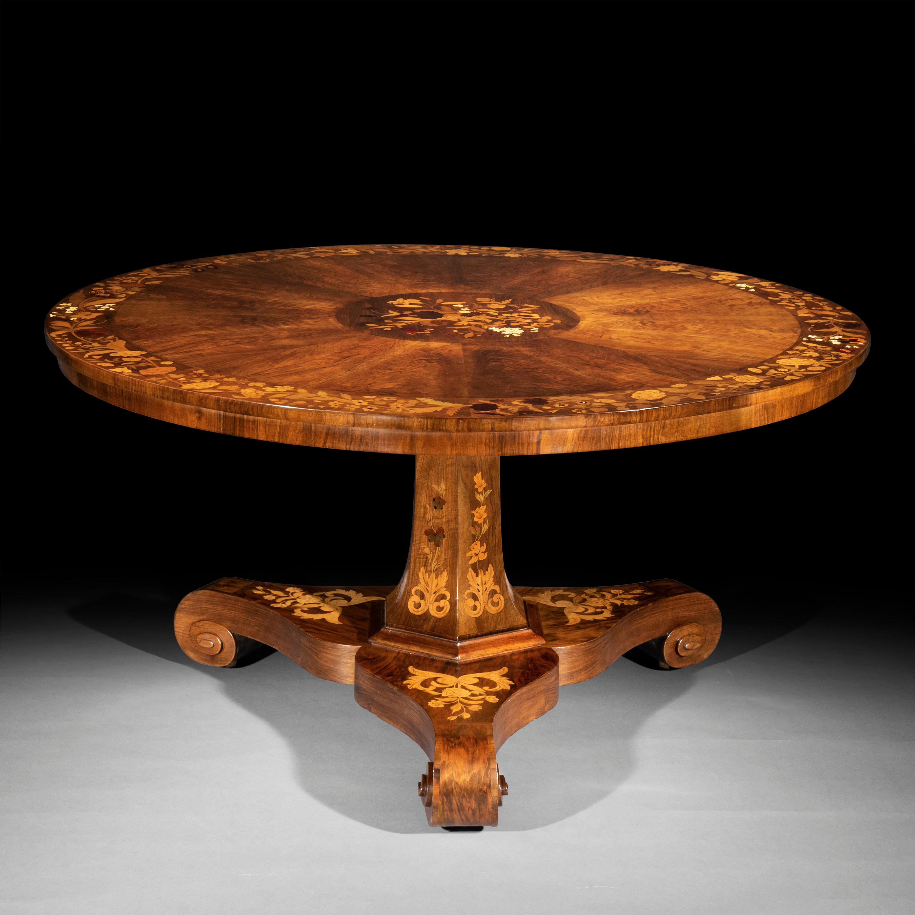 A splendid Late Regency - William IV period pedestal dining table in figured walnut, exquisitely decorated throughout with floral marquetry inlays in various exotic veneers and bovine bone.

England, circa 1835.

Why we like it

This table is of