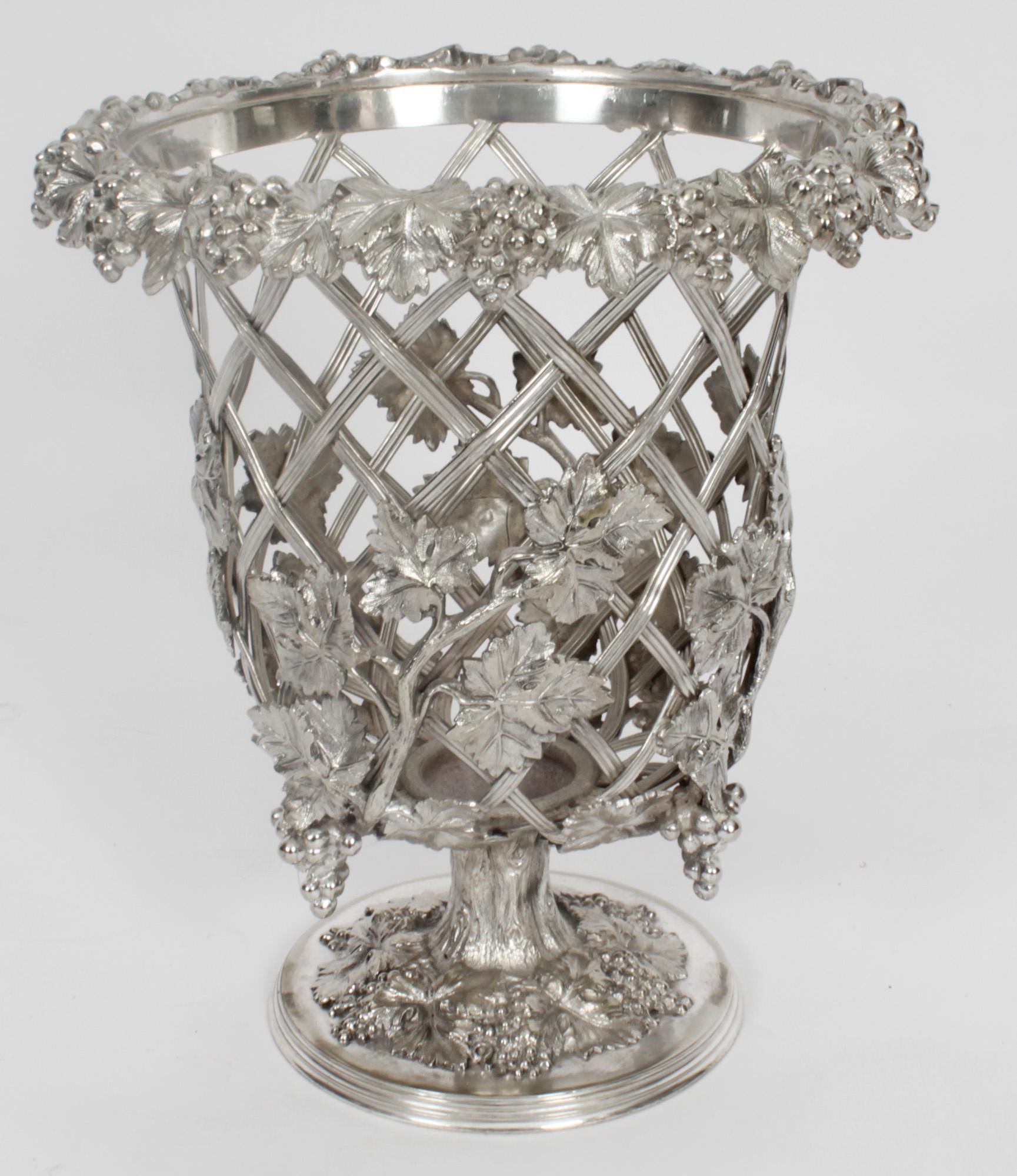 This is a wonderful, rare and highly decorative antique English Old Sheffield Plate Regency wine cooler of campana form, Circa 1820 in date.
 
It is embellished with applied vine leaf decoration over a trellis frame, and is raised on a circular