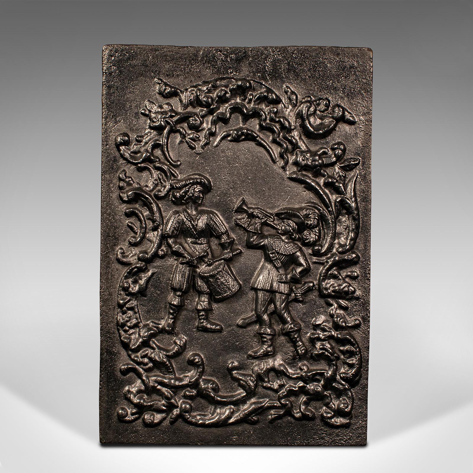 This is an antique relief fire back. An English, cast iron decorative hearth panel, dating to the mid Victorian period, circa 1850.

Pleasingly cast relief panel for the fireplace
Displays a desirable aged patina and in good original