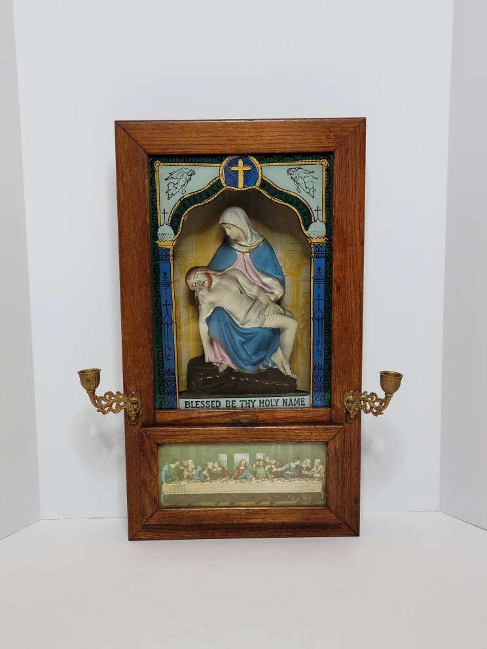 An antique, circa 1910, Catholic Eucharist (also called Holy Communion) sick call wooden shadow box, used to give a person who is dying last rites in the Catholic religion.

This early 20th century icon for Catholic homes features a solid oak
